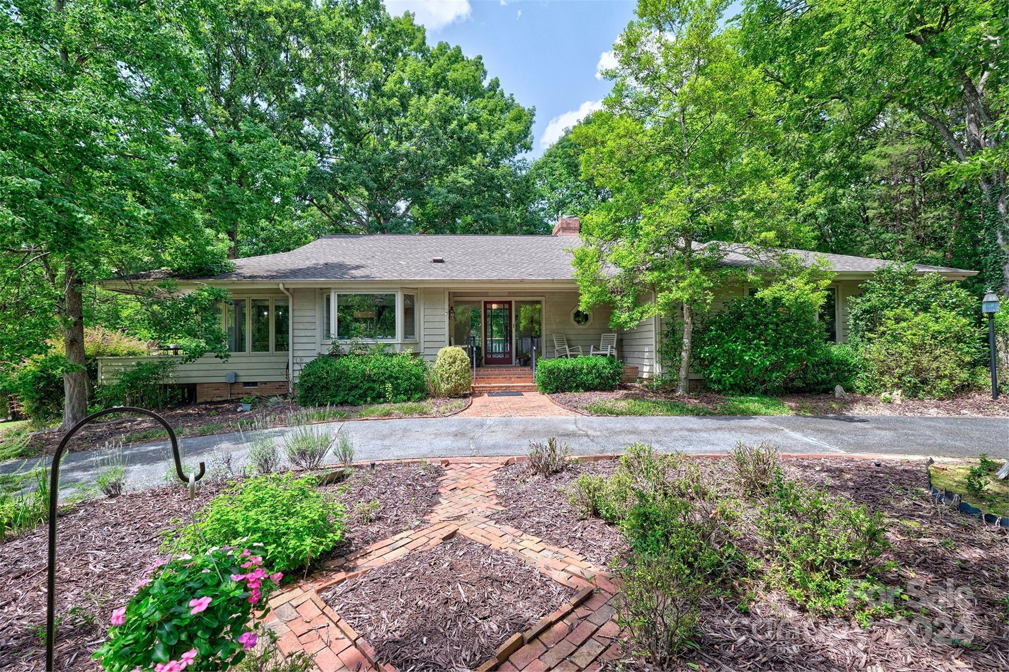 PRICE IMPROVEMENT!Welcome home to the amenity filled gated,golf course/country club & waterfront community of River Hills on Lake WylieThis private home is nested in the trees for a true treehouse feel especially from the sunroom!Seasonal water views from the front porch.Large ranch with full basement.Home offers 3 bedrooms,including the primary,2 1/2 baths on the main floor along w/ formal dining room,eat in kitchen,butler pantry w/ prep sink,HUGE sunroom, laundry and great room with fireplace.The basement offers additional bedroom, man cave/workroom/shop/flex space and large closet that we have quote for to convert to an additional bathroom. The oversized 2 1/2 car garage is perfect for that golf cart along with your 2 cars.The home needs remodeling /updating so Bring your ideas and designs and make this home your own.It has great bones to work with! The neighborhood also offers miles of walking trails,waterfront sandy beach park,playgrounds,marina, dog park & more!Clover Schools!