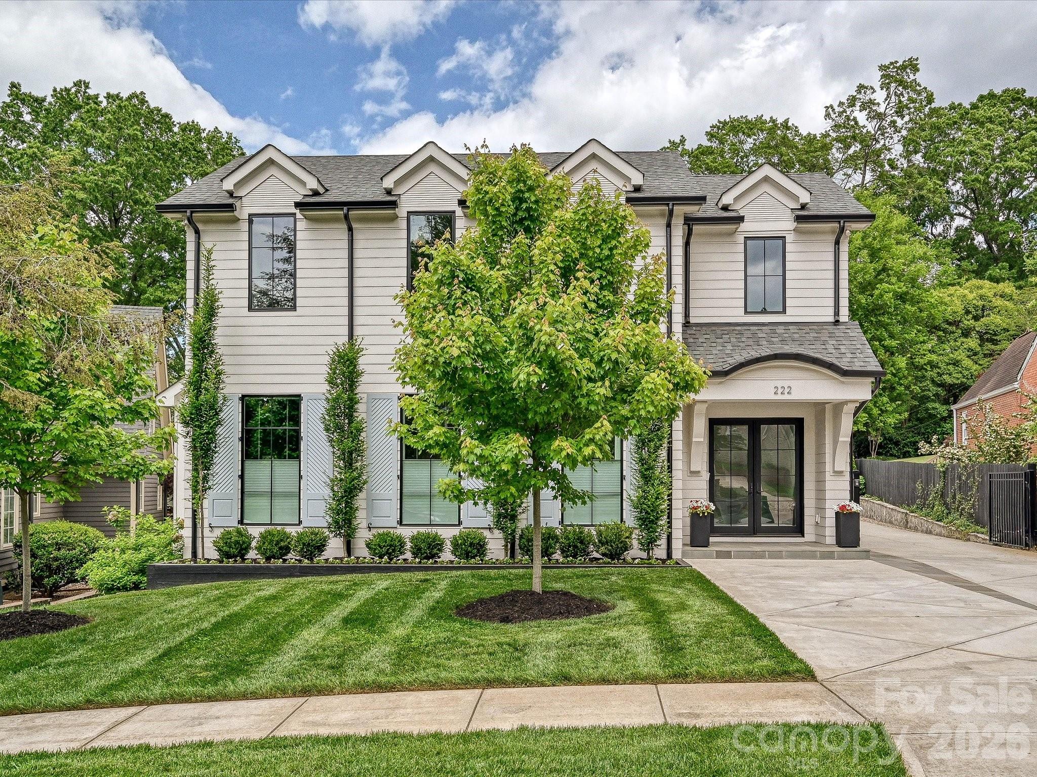 Thoughtfully designed for both everyday living and effortless entertaining, this beautifully appointed home offers a seamless blend of comfort and versatility. The main level features inviting gathering spaces, two fireplaces, a private office, and a well-equipped chef’s kitchen with 6 burner gas range, wet bar, walk-in pantry, and an oversized laundry room with additional refrigeration and wine storage. The primary suite is conveniently located on the main level with a spacious walk-in closet and bath featuring towel warmers and plumbing in place for a future soaking tub. Upstairs, generously sized bedrooms, walk-in closets, and en-suite baths are complemented by a large bonus/recreation room and additional laundry. A standout feature is the expansive, fully climate-controlled detached garage complete with a full bath, washer/dryer hookup, plumbing for a future kitchen, and fully pocketing garage doors—ideal for a guest suite, studio, or ultimate entertaining space. Outdoor living includes a covered porch and separate patio with custom wood burning fireplace, fenced yard, electric gate, irrigation system, new retaining walls with drainage, and available plans for future pool. Additional features include whole-home speakers, electric and manual top-down/bottom-up shades, encapsulated crawl space with dehumidifier, sump pump, and concrete driveway. A rare opportunity offering flexibility, thoughtful upgrades, and exceptional indoor-outdoor living. Walking distance to Selwyn Avenue shops, restaurants and Greenway and Selwyn Elementary, AG Middle School and Myers Park High School.