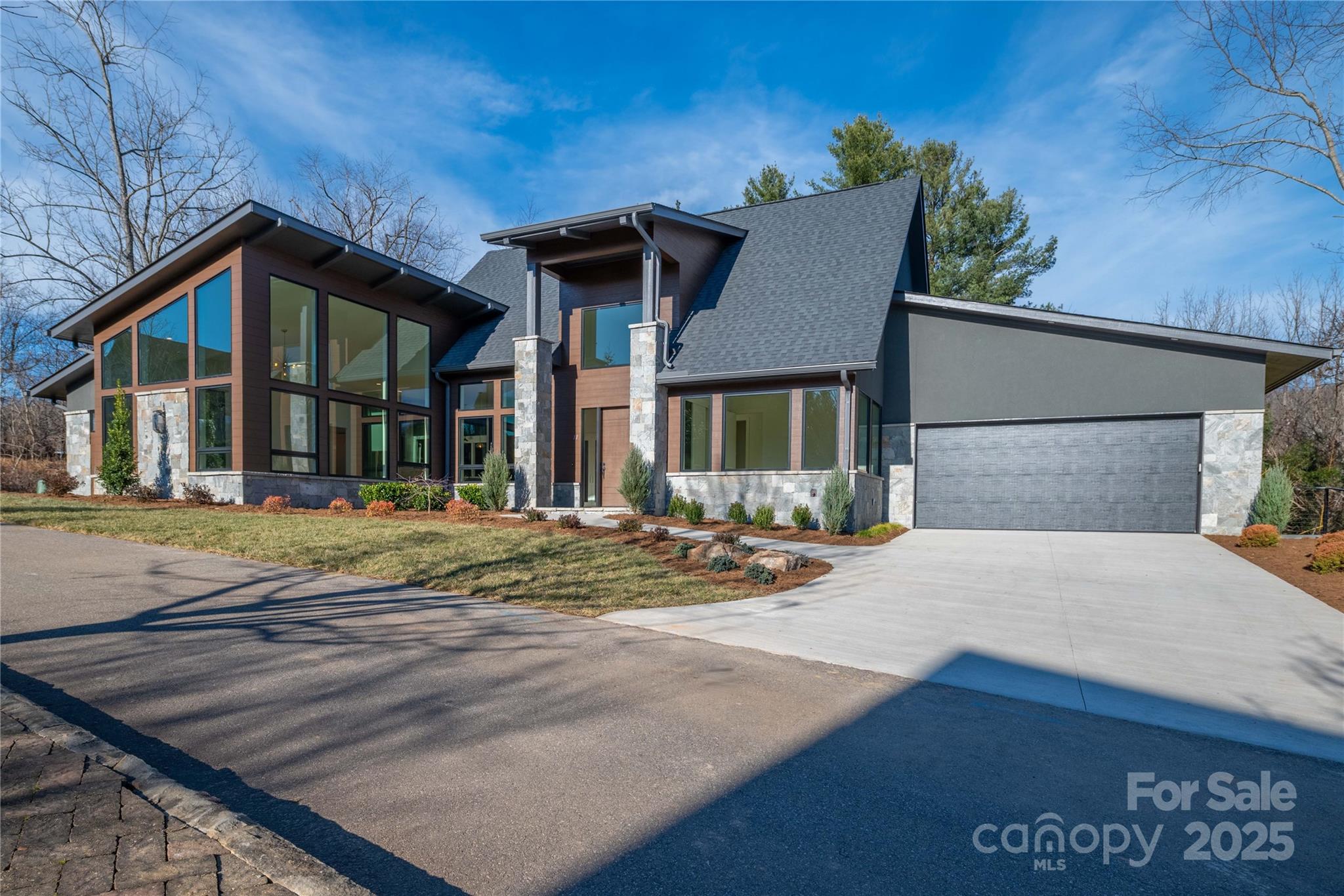 Newest home from the developer at The Thom's Estate!  NEW CONSTRUCTION!

Mountain Modern living all on one level with a large, private backyard (can be fenced in!). Our modern design features vaulted and raised ceilings, and interior finishes were professionally selected.  The kitchen features extra cabinetry with luxury quartz and granite countertops and backsplash. The living room and office have ample windows flooding the house with natural light and providing mountain views.  The rear screened porch opens onto an open deck with a natural gas grilling connection.  Energy Star Certified.