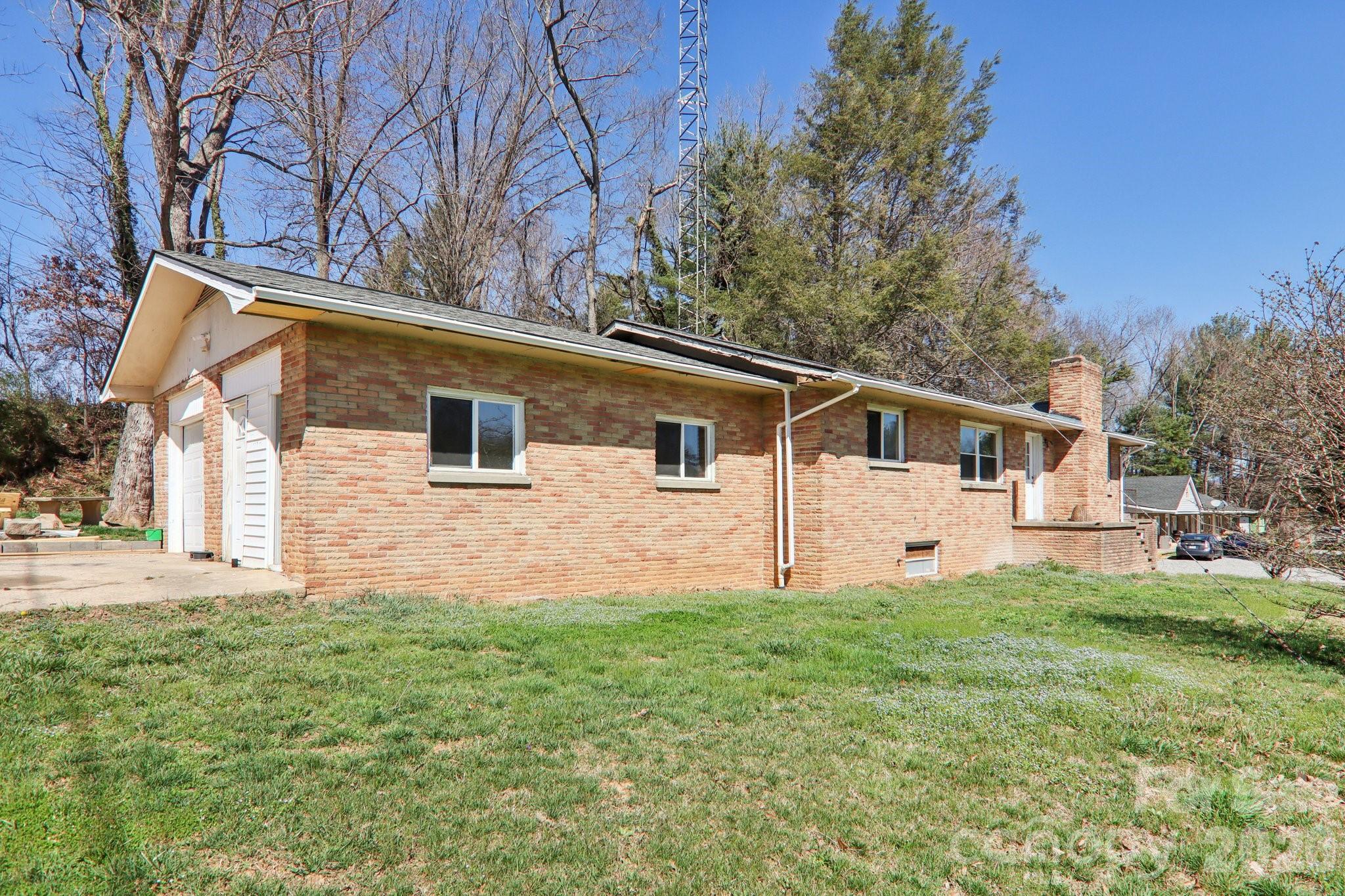 Is there a 3-bedroom brick rancher under $300K in Haywood County with updates, basement space, and income potential? 541 Paragon Parkway delivers with fresh interior updates, 1,712 square feet of living space, a full unfinished basement ready for expansion, and a rare billboard lease producing approximately $2,200 per year.

Welcome to 541 Paragon Parkway, a classic 1953 brick ranch home offering approximately 1,712 square feet of living space on a generous 0.5-acre lot in a convenient Haywood County location close to everyday amenities.

This 3-bedroom, 1 full bath, and 1 half bath home features a practical layout with recent improvements already completed, making it ready for occupancy, rental income, or future updates.

Recent improvements include:

• Fresh interior paint throughout the home
• New carpet in key living areas and bedrooms
• Durable new vinyl plank flooring
• New garage door for the attached one-car garage

The home also includes a full unfinished basement, offering significant additional square footage for storage, workshop space, or future finished living areas. With some sheetrock already in place, the basement provides a strong starting point for buyers looking to add value or expand usable space.

A truly unique feature of this property is the billboard located on the property that generates approximately $2,200 annually, creating a rare passive income opportunity that can help offset ownership costs.

Situated on approximately half an acre, the property provides space to enjoy the outdoors while still being conveniently located near shopping, dining, schools, and major routes throughout Haywood County.

Whether you're looking for a move-in-ready home, an investment property, or a place with future potential, this 3-bedroom brick rancher offers solid construction, recent updates, expansion possibilities, and a unique income-producing feature rarely found in residential properties.