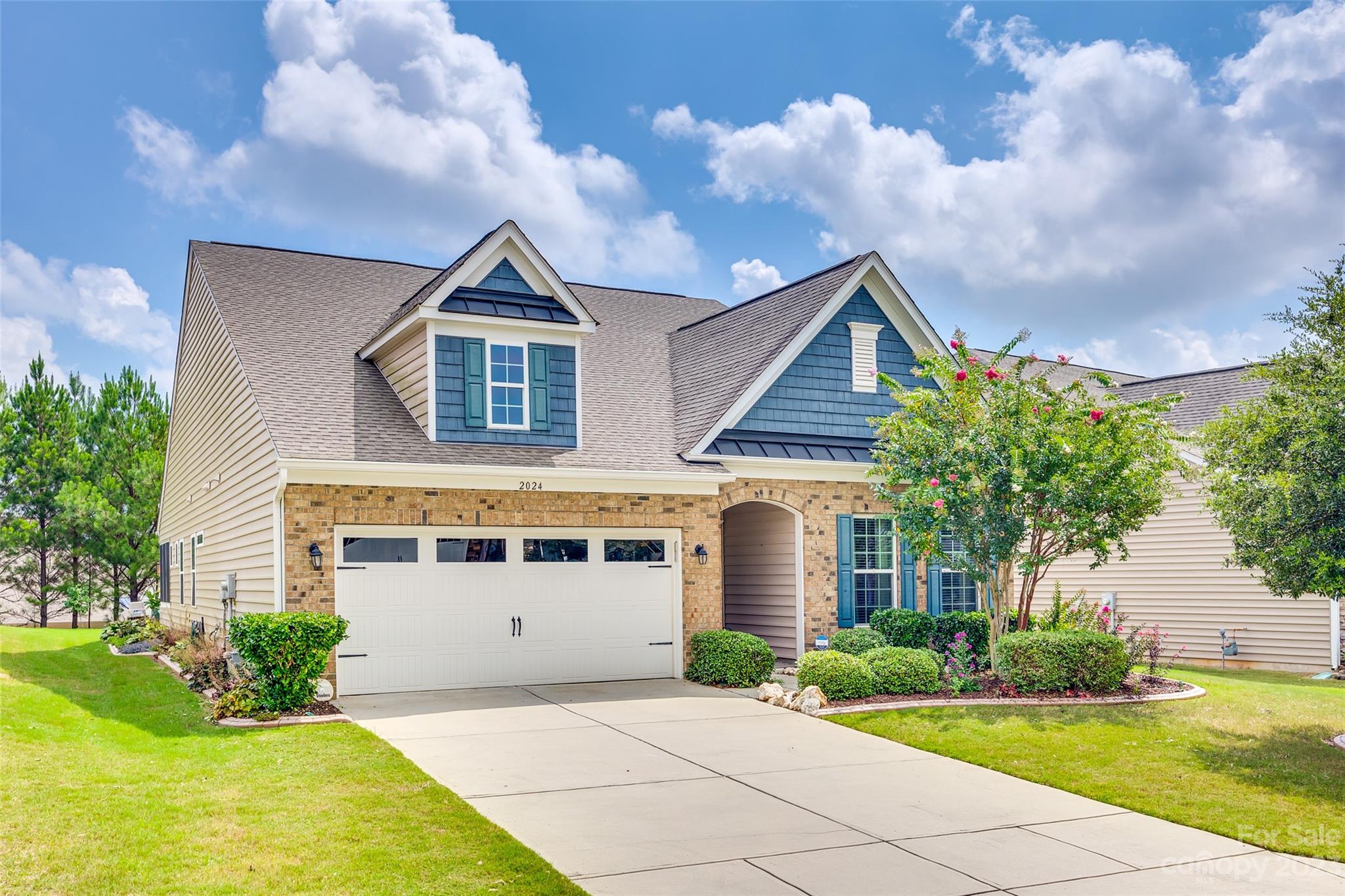Welcome home to this 3 bedroom, 2.5 bath meticulously maintained Carolina Reserve ranch. The heart of this home is the kitchen which features an oversized island, perfect for cooking or social gatherings. Pull-out drawers add a touch of convenience to this already well-appointed kitchen. This home offers both a formal dining room & a breakfast area, providing versatile dining options. The living room is graced by a gorgeous stone fireplace, creating a warm & inviting space. The primary bedroom is a true retreat, complete with a spacious sitting area & direct access to the screened porch.  The en suite features dual sinks, a large shower with a bench,  & a walk-in closet with an upgraded closet system. Step outside to your backyard oasis, which provides a tranquil setting for relaxation & entertainment. A fire pit & hot tub enhance the outdoor experience, perfect for year-round enjoyment. HOA includes trash pickup/recycling, lawn maintenance, and neighborhood amenities.