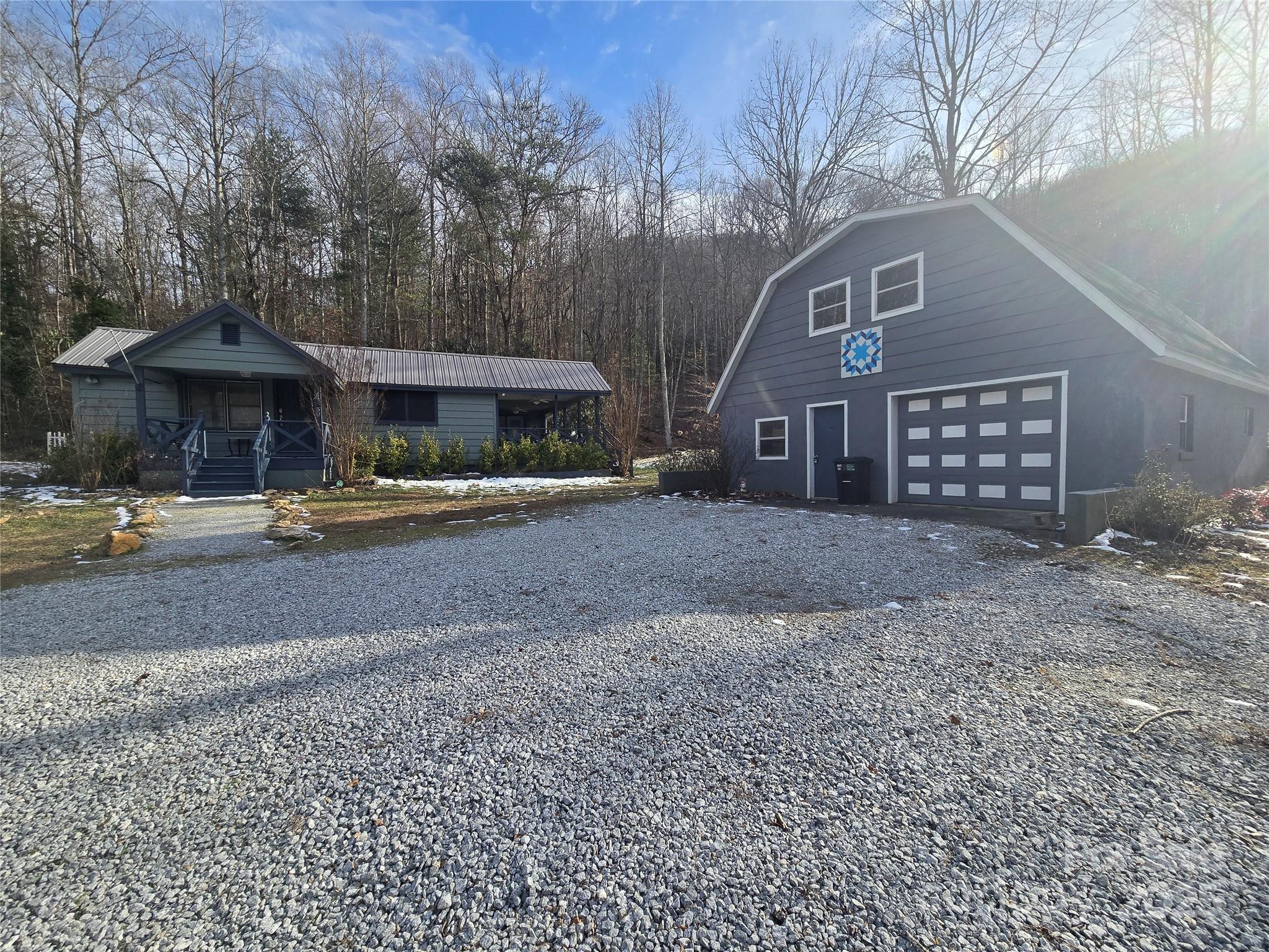 Wow!! That's what you will say when you walk into this immaculate, charming, historical farmhouse! Located a short distance outside of Franklin, NC, you are still convenient to everything! Only 15 minutes to Clayton, GA. Currently used as a short-term rental and being sold fully furnished. This 2 bedroom plus bonus room, turn-key investment is ready for you! The best part...it includes 16.5 acres of unrestricted property! Build another home or keep it for privacy. Large barn with upstairs loft area. Beautiful firepit area and several covered porches to rock the day away. Easy year-round, paved access. Don't miss this one!