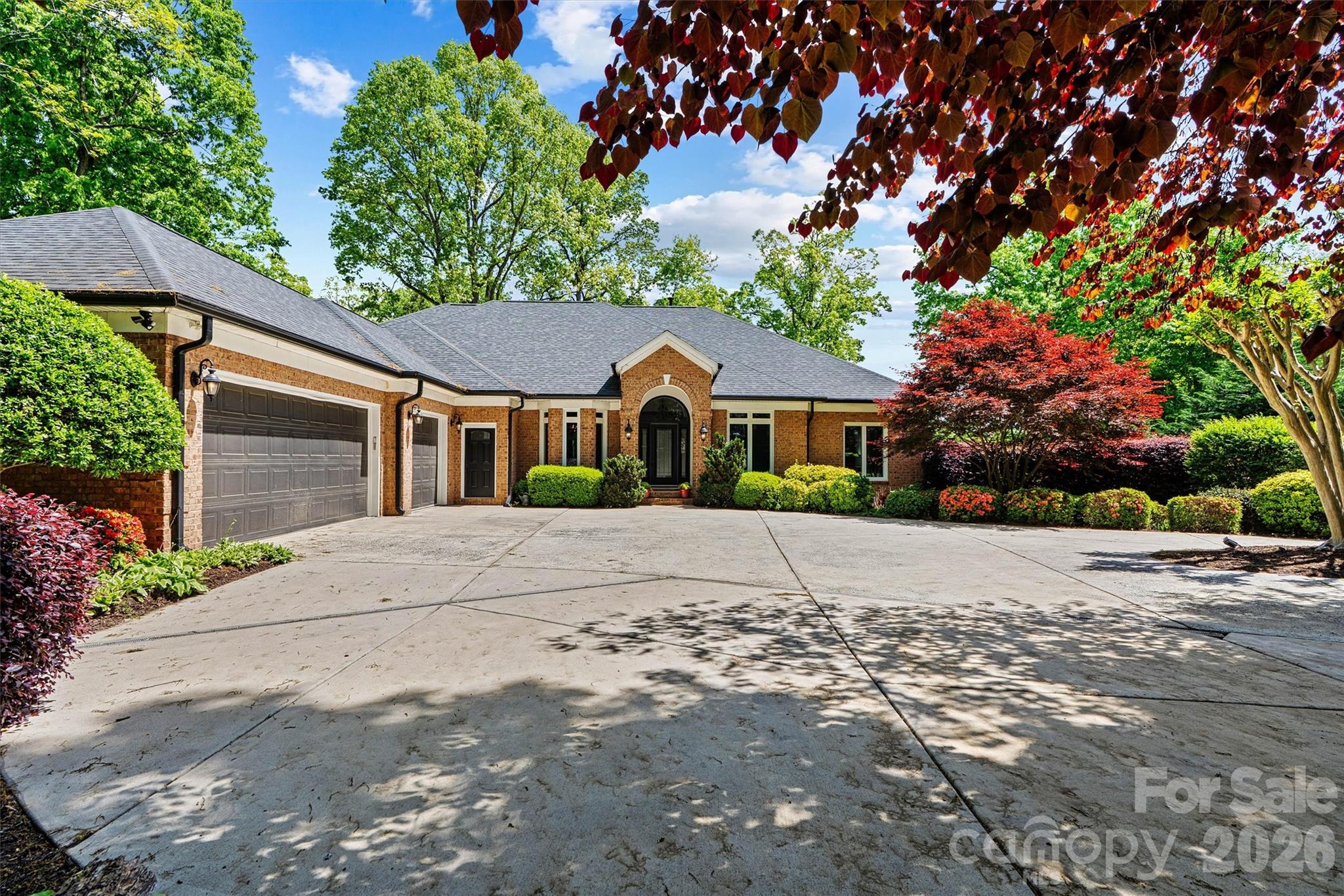 Welcome to luxury lake living in the highly sought-after Heron Harbor Subdivision on Lake Norman. This exceptional estate at 22026 Satilla Drive offers an impressive 7490 square feet of living space on a generous 0.69-acre lot, perfectly designed for comfort, entertaining, and waterfront enjoyment. This expansive 1-story with basement full brick home features room for the entire extended family for all the family gatherings with 7 bedrooms, 5 full bathrooms, and 1 half bath.  After purchasing the home in 2020 and shortly after confronted with the pandemic these sellers went to work completely renovating this home literally from top to bottom.  Inside features all new hardwood floors encompassing the entire main level, modern fixtures and paint, full luxury spa like bathroom renovations, kitchen reno with updated appliances and quartzite counter tops, and all new doors and windows.  That's just the main floor.  The basement inlaw suite (the most luxurious I have seen brought to market) was completely reimagined  It features an elevator to provide easy access to the main floor, 2 full bedrooms, custom kitchen that rivals the main kitchen in most homes, full bath with no step shower entry, laundry, multiple storage closets and pantry, large living and dining area as well as beautiful lake views and easy walk out.  

In addition to the many interior updates made throughout the home the owners also took care of all the big ticket items you don't think about as well including a 2020 roof, two new water heaters, new gutters with gutter guards (installed approximately 2 years ago), one HVAC unit replaced 4 years ago, new Grinder Pump from basement to sewer 3 years ago,windows, and garage door openers.

Designed for today’s connected lifestyle and with so much sq footage to be covered, the home is equipped with a whole-house mesh WIFI system and a security system with cameras that convey along with a bolted in safe.

Car enthusiasts and hobbyists will appreciate the 4 garage spaces, with a 3-car garage on the main level and an additional lower-level garage that is best used as the lake toy storage or a shop. 

Step outside to enjoy the large back deck or patio from basement both of which are completely shaded in the afternoon.  You will immediately notice the lush landscaping of this property including a full-yard irrigation system and a dedicated garden bed irrigation system.  Both of which have this property looking absolutely stunning in full spring bloom at the moment. Prior to heading down to the lake take a moment to take in the privacy and surroundings from the fire pit and gold fish pond with fountain.  Once you take the very easy stroll to the lake you will encounter true lakefront living with a floating private dock, perfect for swimming, boating, fishing, and relaxing on Lake Norman. The beautifully maintained grounds , and a serene fish pond with a new pump and goldfish. The back deck offers comfortable afternoon shade beginning around 3:30 PM—ideal for outdoor gatherings.

Conveniently located near Interstate 77, this home provides easy access to Birkdale Village for premier shopping, dining, and entertainment, and is just 30 minutes from Charlotte.

This rare Lake Norman property combines luxury, space, and prime location—an extraordinary opportunity to own a premier waterfront home.