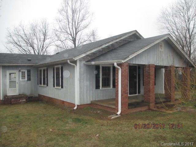 Home sits on 1.80 acre lot.  Needs improvements and tlc. Lot of home for the money! Sold As Is!