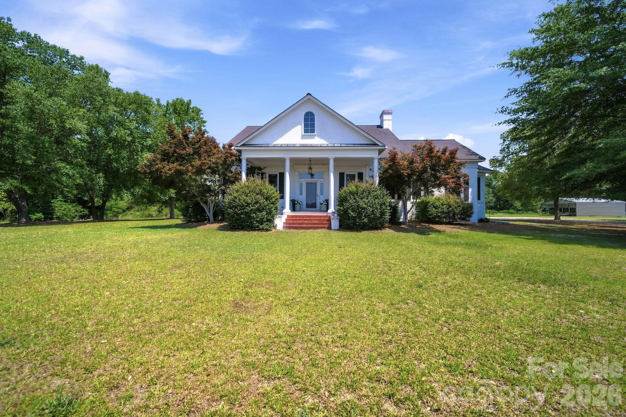 Are you looking for land? Do you have horses that need room to roam and a beautiful house attached to the land? Look no further! 1004 Four Mile Loop Road in Cheraw, SC is ready for you to call it your home, sweet home.

Set on an impressive 13.67 acres, this exceptional home offers space, privacy, and versatility for refined country living. 5 Bedroom, 4.5 Bathroom 5,011-square-foot home features a spacious primary suite on the main level, thoughtfully designed with luxury in mind. There's a lovely dining room with beautifully high ceilings, a two-story foyer and a full office designed for working from home. The Living room is spacious and airy with a gas fireplace to keep it cozy. Upstairs, you’ll find 4 generously sized bedrooms along with two bonus rooms, perfect for a second floor office, gym, media room, or play space. The bonus space above the garage could make a great separate quarters with access to a full bathroom and entrance from the side door. All hard surface flooring throughout and updates in lighting, you need to see this in person!

Outdoors, the property truly shines. Enjoy an in-ground pool ideal for entertaining, a six-stall horse stable for equestrian enthusiasts, two pastures for your horses, a dedicated dog run, and chicken coop. You can truly enjoy all the perks of country living here! With expansive acreage and endless possibilities, this one-of-a-kind property offers the perfect blend of luxury, functionality, and rural charm. Come see it today!
