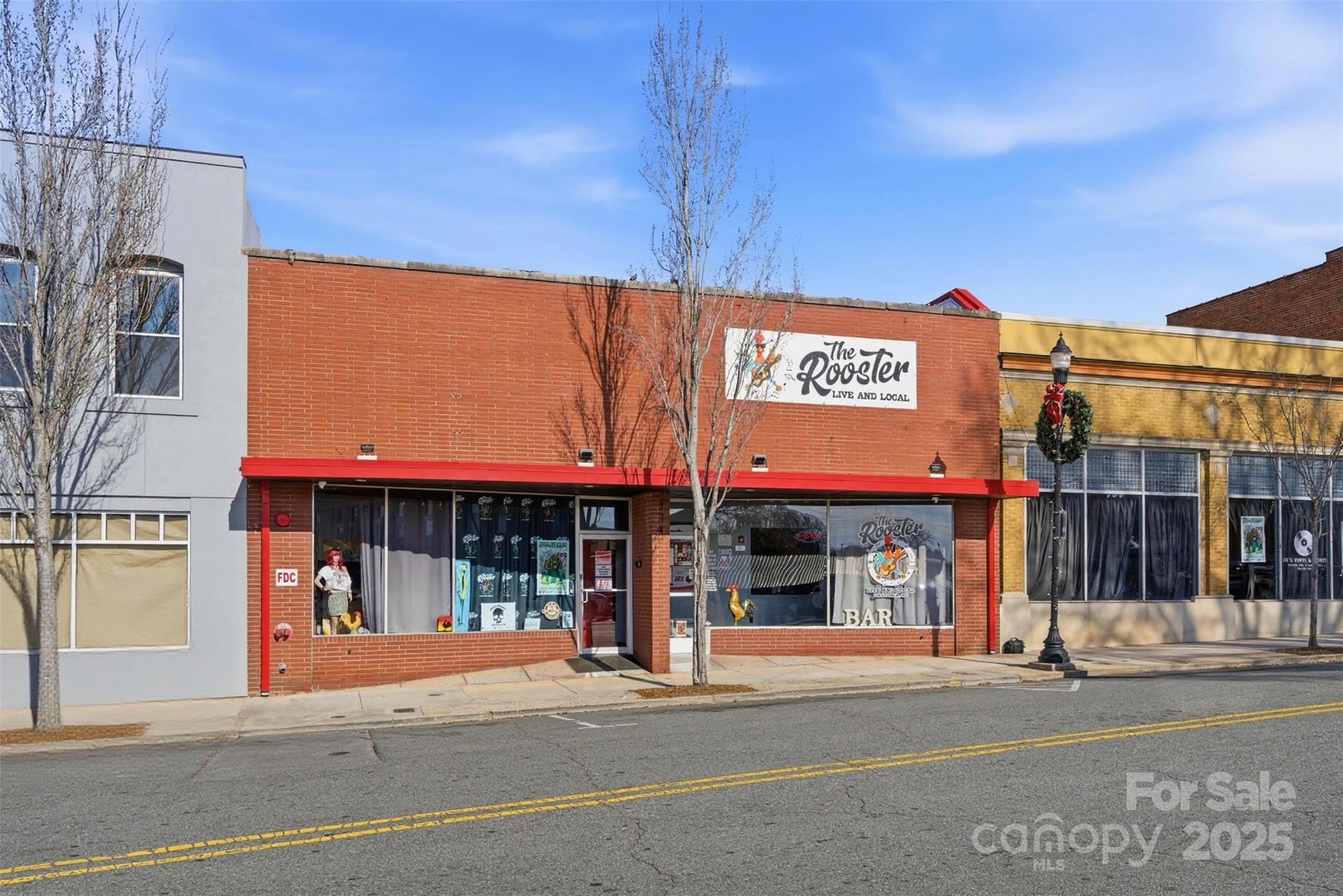 Nestled in the heart of Gastonia’s thriving downtown district, 334 W Main Avenue presents an exceptional opportunity to own a fully operational live music and event venue with 41-feet of road frontage. Purpose-built for entertainment, this dynamic property features spacious seating areas, numerous tables, and a stylish, fully equipped bar that sets the stage for an inviting and lively atmosphere. 190 person capacity if used as a music venue, capacity could adjust based on venue use. This building located in an opportunity zone was built in 1915 and renovated in 2022.

With a flexible, open-concept layout, the venue easily accommodates events of all sizes — from intimate performances and private gatherings to large-scale concerts and social celebrations. This versatility makes it an ideal investment for hospitality entrepreneurs, event promoters, or visionaries seeking to bring a new concept to life.  All systems have been updated, HVAC, etc.  Please see the equipment list for most items in the space.

The property is available for sale with the option to include existing equipment, offering a true turnkey solution for those ready to hit the ground running.

Located within walking distance of Gastonia’s great dining, boutiques, and cultural attractions — and just minutes from major highways — this venue enjoys excellent visibility and accessibility. As Gastonia’s arts and entertainment scene continues to grow, this property stands at the center of opportunity, drawing steady foot traffic and strong community interest.

Whether you envision continuing its successful legacy as a live music hub or transforming it into a one-of-a-kind destination, 334 W Main Avenue delivers unmatched potential in one of Gastonia’s most vibrant and developing corridors.