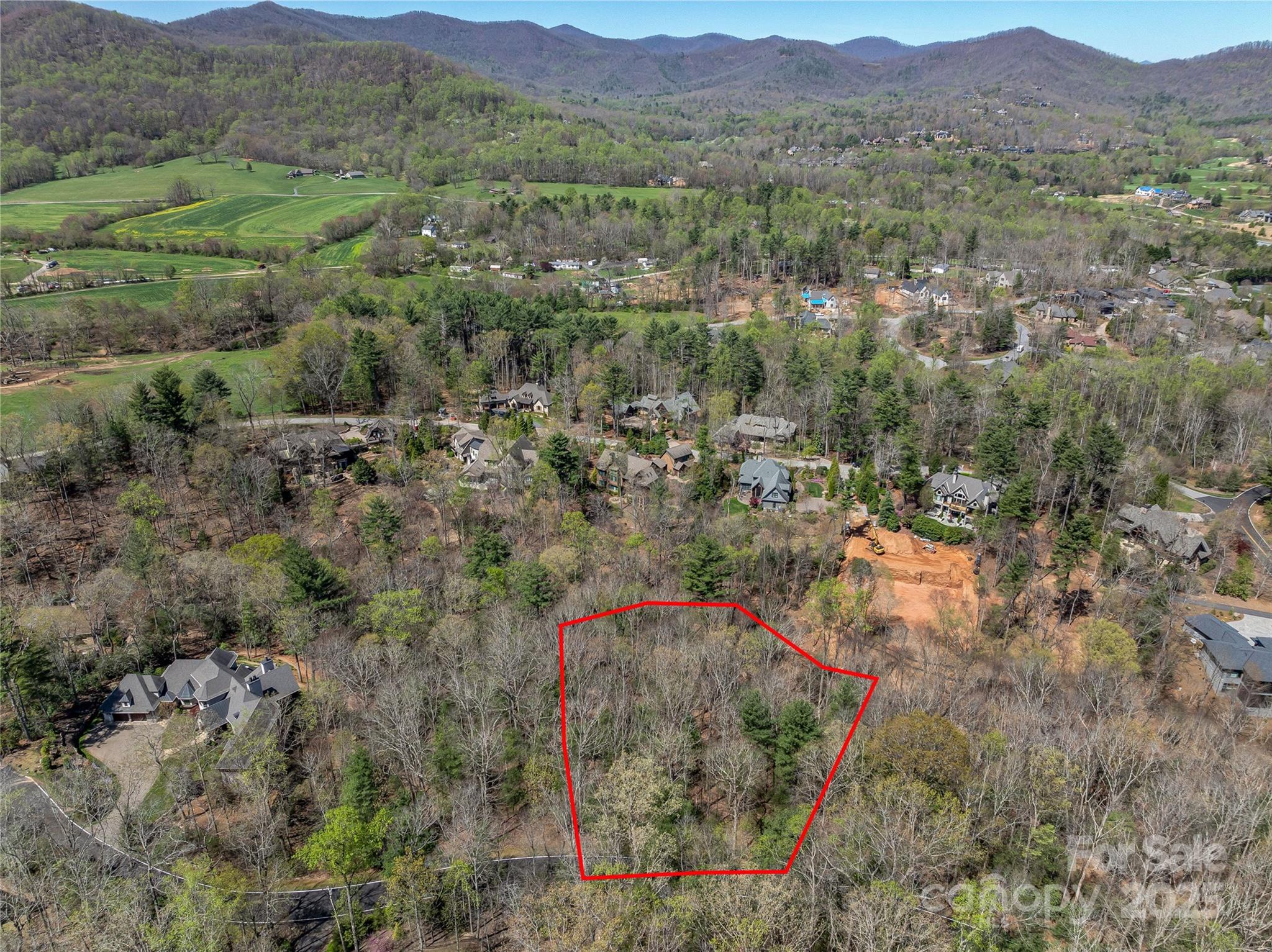 Nestled within the prestigious gates of The Cliffs at Walnut Cove, 37 Dividing Ridge offers an extraordinary opportunity to own a homesite in one of the most sought-after golf communities in the Carolinas. Set against the backdrop of the Blue Ridge Mountains, this property blends privacy, natural beauty, and access to a lifestyle unmatched in Western North Carolina. Positioned on a wooded site, the lot captures beautiful nature views that shift with the seasons—from vibrant fall foliage to soft spring greens, creating a living canvas that evolves day by day.
The homesite itself provides a sloping build envelope, ideal for a custom residence that maximizes both indoor and outdoor living. Mature hardwoods frame the property, offering seclusion without sacrificing connection to community amenities. With close proximity to the Jack Nicklaus Signature Golf Course, residents enjoy effortless access to world-class golf, while also being near scenic walking trails, wellness facilities, and the community’s expansive clubhouse.
Life at Walnut Cove is defined by more than just stunning views and championship golf. Membership unlocks access to The Cliffs’ network of seven communities, each with its own character and amenities. Whether it’s dining at award-winning restaurants, enjoying lake activities at Keowee, exploring hundreds of miles of hiking trails, or attending curated social events, ownership here extends far beyond a single neighborhood. Residents enjoy state-of-the-art wellness centers, indoor and outdoor pools, tennis and pickleball courts, and a robust calendar of cultural programming.
Located just minutes from vibrant Asheville, Walnut Cove offers the perfect balance of mountain retreat and city convenience. From art galleries and live music to farm-to-table dining, Asheville enriches the lifestyle awaiting you at 37 Dividing Ridge. This is more than a homesite—it’s an invitation to craft a legacy in one of the region’s premier luxury communities.