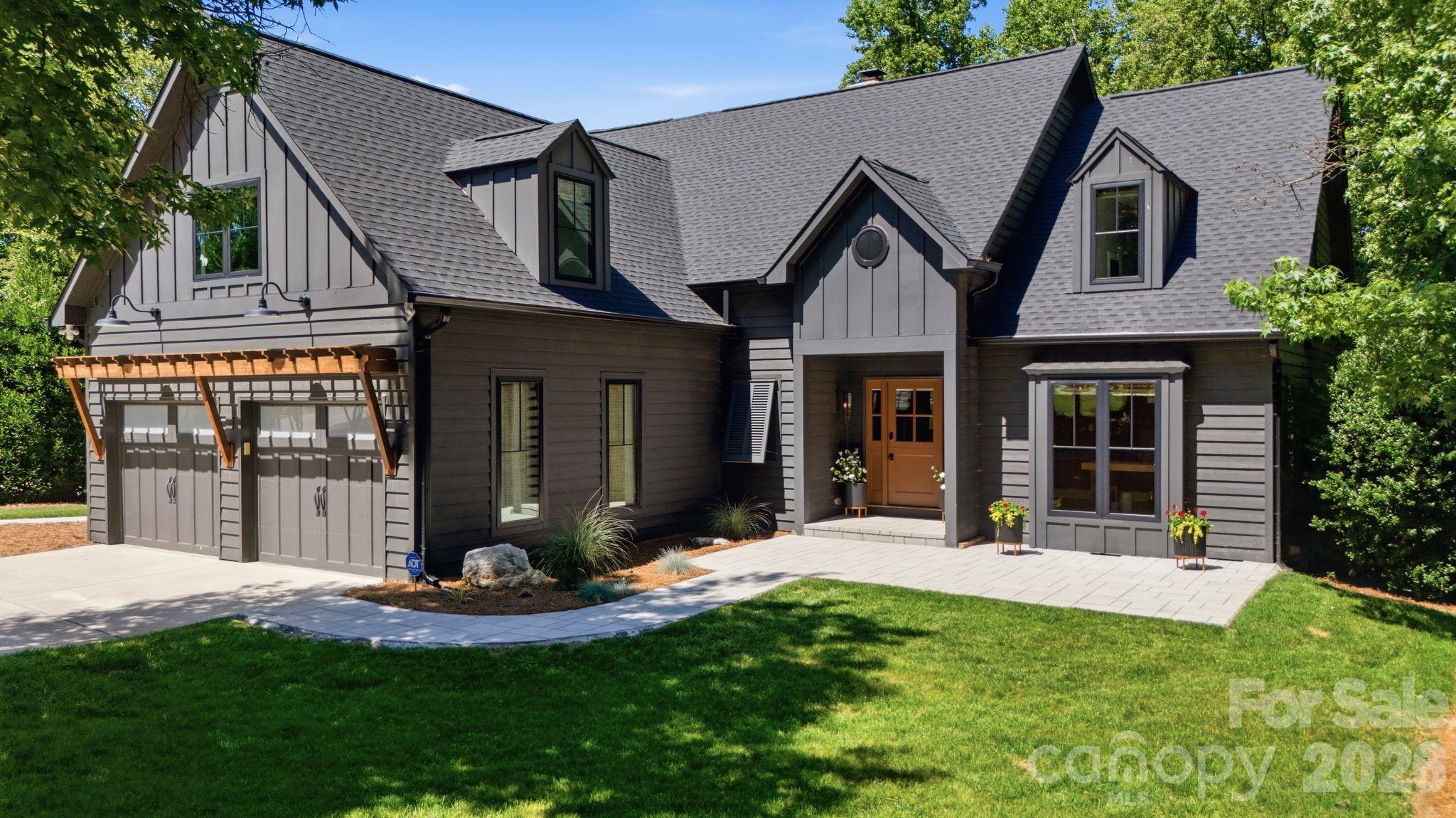 Experience luxury waterfront living on Lake Norman in this beautifully renovated home located in the sought-after Diane Shores community of Cornelius. Situated on approximately 0.56 acres with year-round water views and direct lake access, this exceptional property offers 4 bedrooms, 3.5 bathrooms, 2,917 square feet of heated living space, and more than 4,653 square feet under roof including expansive porches, decks, patios, and an oversized two-car garage.

Originally built in 1990 and extensively remodeled within the last five years, this home seamlessly blends timeless architecture with modern design and functionality. Featured in QC Magazine and showcased on Houzz, the property was professionally designed by Collaborative Interiors and thoughtfully renovated by APS Renovations. The result is a sophisticated yet comfortable retreat designed for everyday living and exceptional entertaining.

A welcoming Dutch-style front door opens to a bright interior featuring hardwood floors, designer lighting, custom finishes, and abundant natural light. The dramatic two-story great room is anchored by a stone fireplace with reclaimed wood mantel, custom built-ins, wine refrigerator, ice maker, hidden workstation, and stunning lake views. The chef's kitchen features quartz countertops, premium stainless-steel appliances, gas cooking, convection oven, warming drawer, beverage refrigeration, custom cabinetry, and a large center island ideal for gathering with family and friends.

The main-level primary suite offers the convenience of one-floor living with a beautifully updated bath and easy access to outdoor living spaces. A dedicated office, laundry room, and oversized garage complete the main level. Upstairs you'll find three additional bedrooms, two full bathrooms, a spacious bonus room, and ample storage.

Designed to embrace the Lake Norman lifestyle, the outdoor living spaces are truly exceptional. Enjoy a screened porch with retractable screens, outdoor kitchen, dining area, fireplace, and infrared ceiling heaters that create a comfortable year-round entertaining space. Multiple decks and patios overlook the water, providing the perfect setting for morning coffee, sunset gatherings, or relaxing by the lake.

The private waterfront setting includes a covered dock, boat lift, and seating area with direct access to boating, paddleboarding, fishing, and all that Lake Norman has to offer. Additional features include updated windows and doors, renovated bathrooms, irrigation system, fenced backyard, workshop area, epoxy garage floors, and extensive storage.

Located just moments from The Peninsula Club, Jetton Park, shopping, dining, and top-rated schools, this move-in ready waterfront home offers the rare combination of luxury, privacy, convenience, and an unmatched Lake Norman lifestyle.