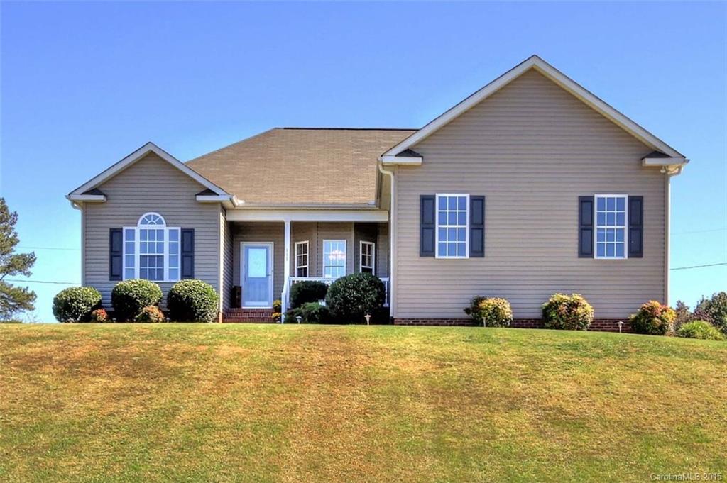 Charming ranch home close to Troutman's beautiful State Park. Private and quite street of homes with no HOA, house sits up overlooking the community. Owners renovated the house with new kitchen, new Whirlpool ss appliances, granite, backsplash, cabinets, pre finished wood, blinds, storm door, lights, fan, tile in both baths, extended deck, extended drive. Half acre lot with side load garage & great space for extra parking. Spacious master bed & bath w/ dual closets. Less than 10 years old!