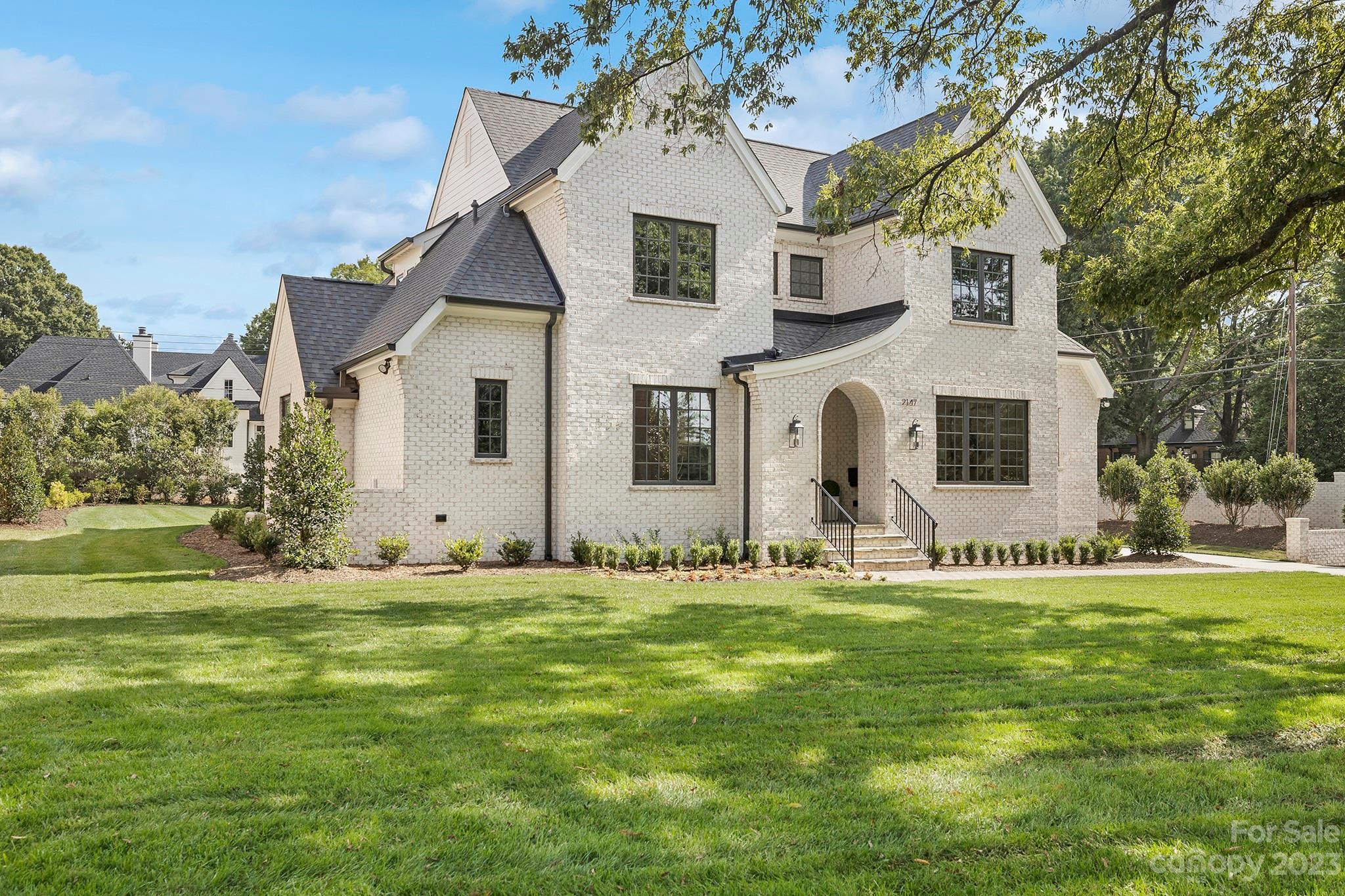 New Construction on .52 acre, nestled in one of the most sought after locations in the heart of Charlotte. Centrally situated minutes from SouthPark, easy access to Uptown and minutes from shops and restaurants. Built by Alan Simonini Homes, one of Charlotte's premier home builders with attention to detail and luxury finishes. Inviting floor plan with Primary Suite + Guest Suite on main level, kitchen equipped with high end appliances, custom cabinetry, and expansive island. Centrally located wet bar for entertaining, as well as covered porch with gas fireplace.  Bonus room on second level along with 3 bedroom each with private baths.  This home features a detached garage and a brick wall spanning Sharon Rd for privacy. This plan was previously designed and built as a custom home in the Heydon Hall community.