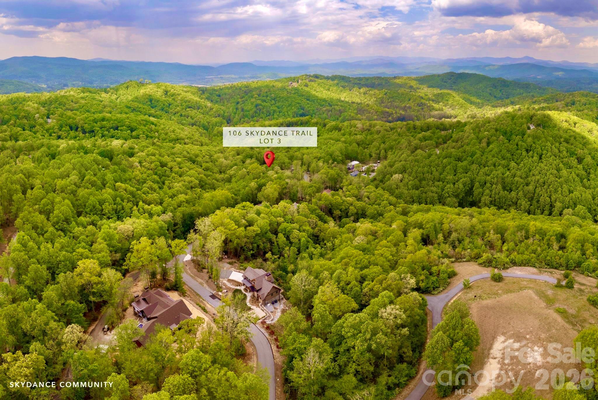 Welcome to 106 Skydance Trail, Lot 3 in the private mountaintop community of Skydance in Western North Carolina. Skydance is a special community offering the convenience, privacy, & natural beauty that the western North Carolina mountains are known for. It’s a private retreat without all the fuss of a country club community & only minutes from AVL airport, as well as the towns of Hendersonville & Brevard. Lot 3 is gently sloped & features beautiful hardwoods & other native flora. A seasonal spring-fed stream runs along one corner of the property, & there are 2 possible sites to choose from. One is near the road and is perfectly level, & the other is nestled in the woods. Electric is already at the site, the septic has been installed, the well permit obtained, and building plans are available. Skydance is close to Dupont State Forest, the Pisgah National Forest, & the Blue Ridge Parkway, as well as the Ecusta Trail, which is only about a mile down the road. Enjoy all that this beautiful area has to offer,  with a wide variety of outdoor recreational opportunities to choose from, including hiking, biking, fly fishing, waterfall exploring, rock climbing, and more.