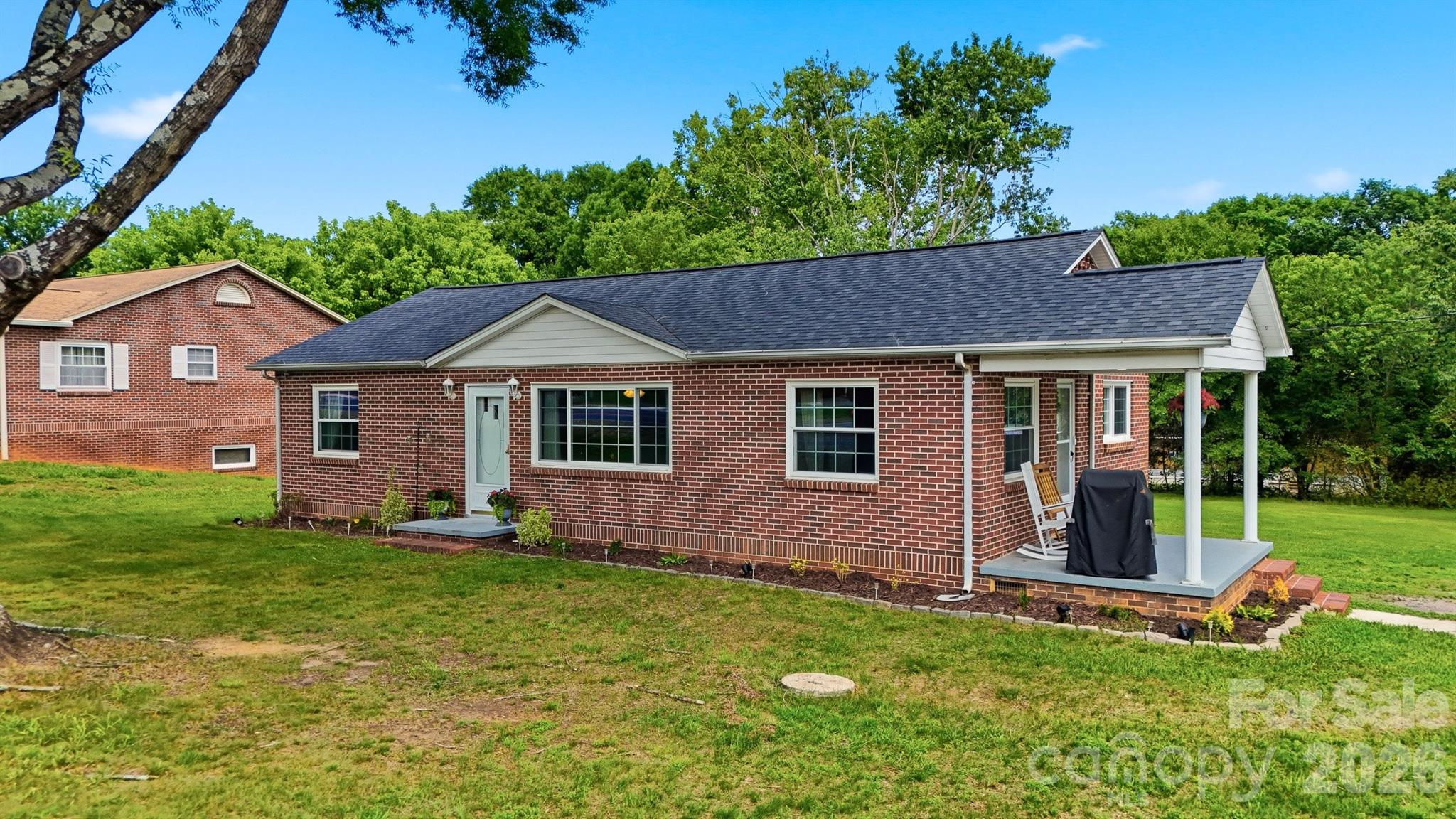 Price Improvement! Move-in ready brick ranch situated on over half an acre in desirable NE Hickory. This charming 3-bedroom, 1-bath home offers a blend of classic character and modern updates, featuring beautiful hardwood floors, updated lighting, and abundant natural light throughout. The updated kitchen provides ample cabinet and countertop space, making it ideal for everyday living and entertaining.

Significant improvements include a roof replaced in 2023 and an HVAC system replaced in 2022, offering added peace of mind for the next owner.

Outside, enjoy a spacious yard with mature shade trees and plenty of room for gardening, recreation, pets, or future outdoor living spaces. A detached outbuilding with a roll-up door and attached covered storage area provides excellent space for lawn equipment, tools, hobbies, or workshop use. The expansive lot offers flexibility rarely found at this price point while maintaining a convenient location close to shopping, dining, schools, and major commuter routes.

Whether you're a first-time homebuyer, downsizing, or searching for an investment opportunity, this well-maintained brick home combines comfort, functionality, and room to grow in one of Hickory's most convenient locations.