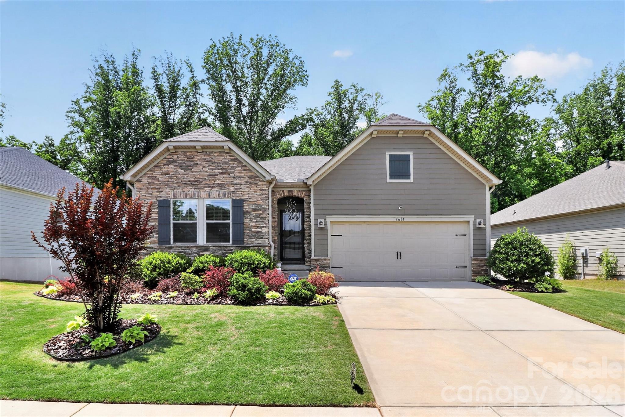 Ideally located in the vibrant Vineyards community, this home delivers the perfect balance of convenience and lifestyle. Enjoy close proximity to shopping, dining, Uptown Charlotte, airport, and major commuter routes, while also benefiting from Lake Wylie access and abundant recreational opportunities right in your neighborhood.

Step inside to a bright, open main level featuring a seamless flow between the living, dining, and kitchen spaces—perfect for entertaining or everyday living. A dedicated office and thoughtfully designed living areas provide flexibility for today’s needs, whether working from home, hosting guests, or simply relaxing in comfort.
The standout feature is the light-filled walk-out basement, offering incredible versatility. With over 1,200 sq ft of finished space, including additional living areas and bedroom, it’s ideal for a guest suite, media room, fitness area, or multi-generational living. Additional unfinished sections provide valuable space for storage, a workshop, or future customization—allowing you to tailor the home to your evolving lifestyle.

Outdoor living truly shines here. Enjoy a beautifully hardscaped backyard patio, a screened-in porch for year-round comfort, designed for both entertaining and quiet evenings at home. The walk-out lower level creates a connection between indoor and outdoor spaces, enhancing usability and enjoyment.