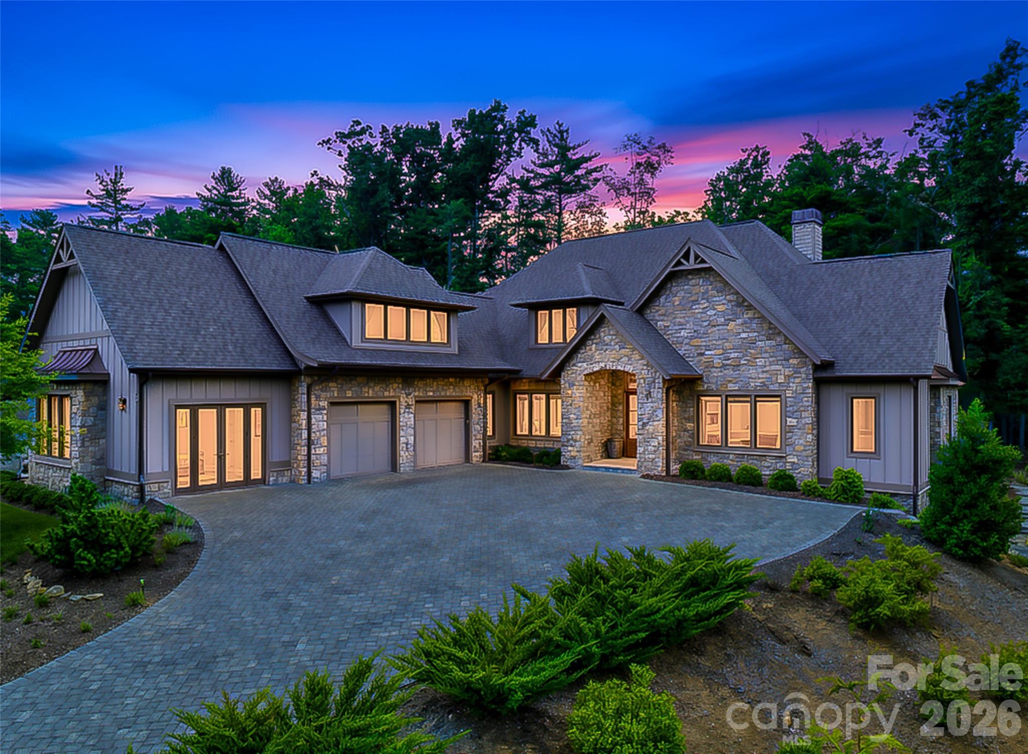 Nestled atop a charming knoll within the prestigious The Cliffs at Walnut Cove, this luxury retreat offers a rare combination of privacy, convenience, and future potential. Designed for effortless living, the approximately 4,000-square-foot floor plan unfolds entirely on one level and features three spacious bedrooms, two-and-a-half baths, and a versatile bonus room/studio thoughtfully converted from the third garage bay. 

Custom designer lighting enhances every space, adding warmth and sophistication throughout. The screened patios invite year-round enjoyment, seamlessly blending indoor comfort with the beauty of the surrounding mountain landscape. 

Beneath the home, more than 1300 square feet of unfinished space presents an outstanding opportunity to expand with additional living areas, guest accommodations, a fitness room, wine cellar, recreation space, you name it!  Situated mere steps from Walnut Cove’s hiking trails and the community’s renowned wellness center, this property offers an unparalleled lifestyle where luxury, nature, and flexibility come together in one remarkable mountain retreat.

The adjacent lot also available for purchase for a combined 1.8 acre estate. Inquire with the listing agent.