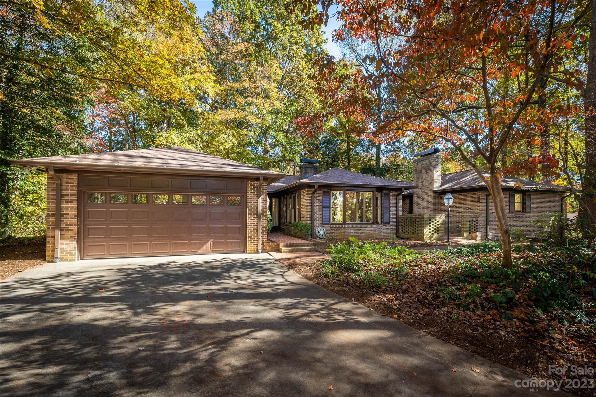 Nestled on a .96-acre wooded lot on a cul-de-sac,  this home has lots of charm and character! Three bedroom, 2.5 bath home on one level. Extensive renovations due to fire, this home has a new roof, HVAC (dual zone),wood floors,  kitchen and bathrooms. Inviting foyer with wormy chestnut and brick flooring.  Beautiful wood floors in living room with lots of light and a fireplace. Main bedroom suite has a Dutch door to the patio, walk-in closet and a tiled shower. Spacious 2nd and 3rd bedrooms have wood floors and ceiling fans. Hall bath has a tub & shower. Plenty of space for enjoying the outdoors with a quaint brick patio and a large screened porch (432 sq. ft.) with a vented grill. Many beautiful spring perennials! Attached garage and parking in the driveway. Unfinished 441 sq. ft. space behind the garage is a great space for a workshop and storage. Storage sheds.