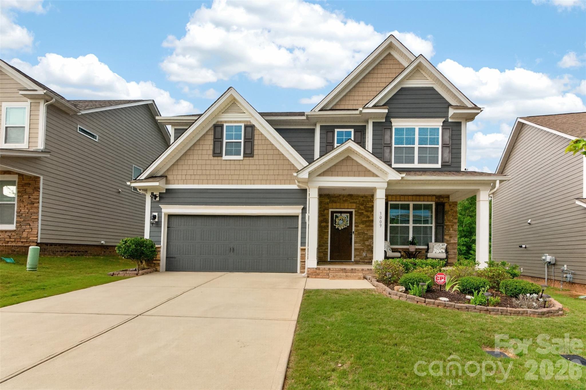 Move-in ready and beautifully appointed, this exceptional 4-bedroom, 4-bath home is located in the highly desirable MillBridge community and offers the perfect blend of luxury, comfort, and functionality. The open-concept floor plan is ideal for everyday living and entertaining, featuring durable LVP flooring throughout the main living areas.

The gourmet kitchen is a true showstopper with quartz countertops, a large center island, double ovens, a gas cooktop, beveled subway tile backsplash, and abundant cabinet space. The kitchen flows seamlessly into the spacious family room, highlighted by a striking stone accent wall and cozy gas fireplace. A bright breakfast area, formal dining room, and convenient drop zone complete the thoughtfully designed main level.

A first-floor bedroom with an adjacent full bath provides the perfect space for guests or a private home office. Hardwood stair treads with elegant rod iron railings lead to the second floor, where you'll find a spacious primary suite featuring a tray ceiling and a luxurious en-suite bath with a soaking tub, separate tiled shower, and dual vanities. Upstairs also offers a versatile bonus room/loft, convenient laundry room, three additional bedrooms, and two full bathrooms.

Step outside to enjoy the screened porch overlooking a beautifully landscaped, fenced backyard with a brick paver patio and no rear neighbors, creating a peaceful and private outdoor retreat. A welcoming front porch adds to the home's outstanding curb appeal.

Located in one of the area's most sought-after communities, this home truly has it all—modern finishes, flexible living spaces, and exceptional indoor and outdoor living. Don't miss your opportunity to make this MillBridge gem your next home!