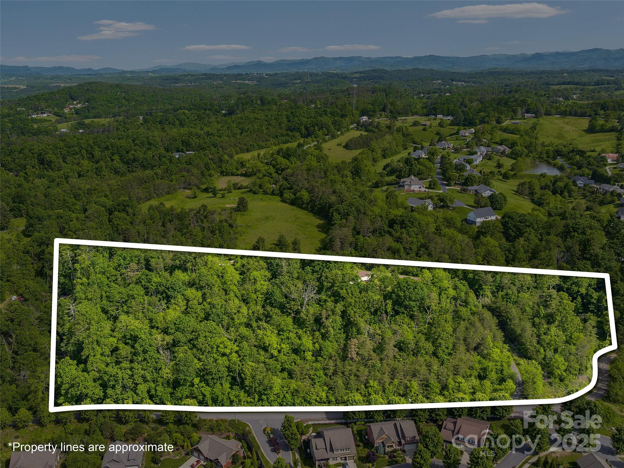 Incredible development opportunity in North Asheville’s highly desirable Asheville 28804 zip code.  Located next to Weaverville, a growing community of Buncombe County with just over 8 acres of prime land. Located directly across from the subdivision,  Pinebrook Farms this is a most attractive commercial residential development tract. This unique property features a mix of gently sloped terrain, mature hardwood trees, short and long-range mountain views, offering natural beauty and space to create a unique setting. Property offers access to a paved, state-maintained road frontage and potential for residential or commercial use (buyer to verify). This site is an ideal location and setting for a custom home community, speculation residential development, a private estate, or other investment projects. Rare chance to own acreage with a natural setting, scenery, long and short range views and convenient access in one of Asheville’s most sought-after North Asheville/Weaverville locations.