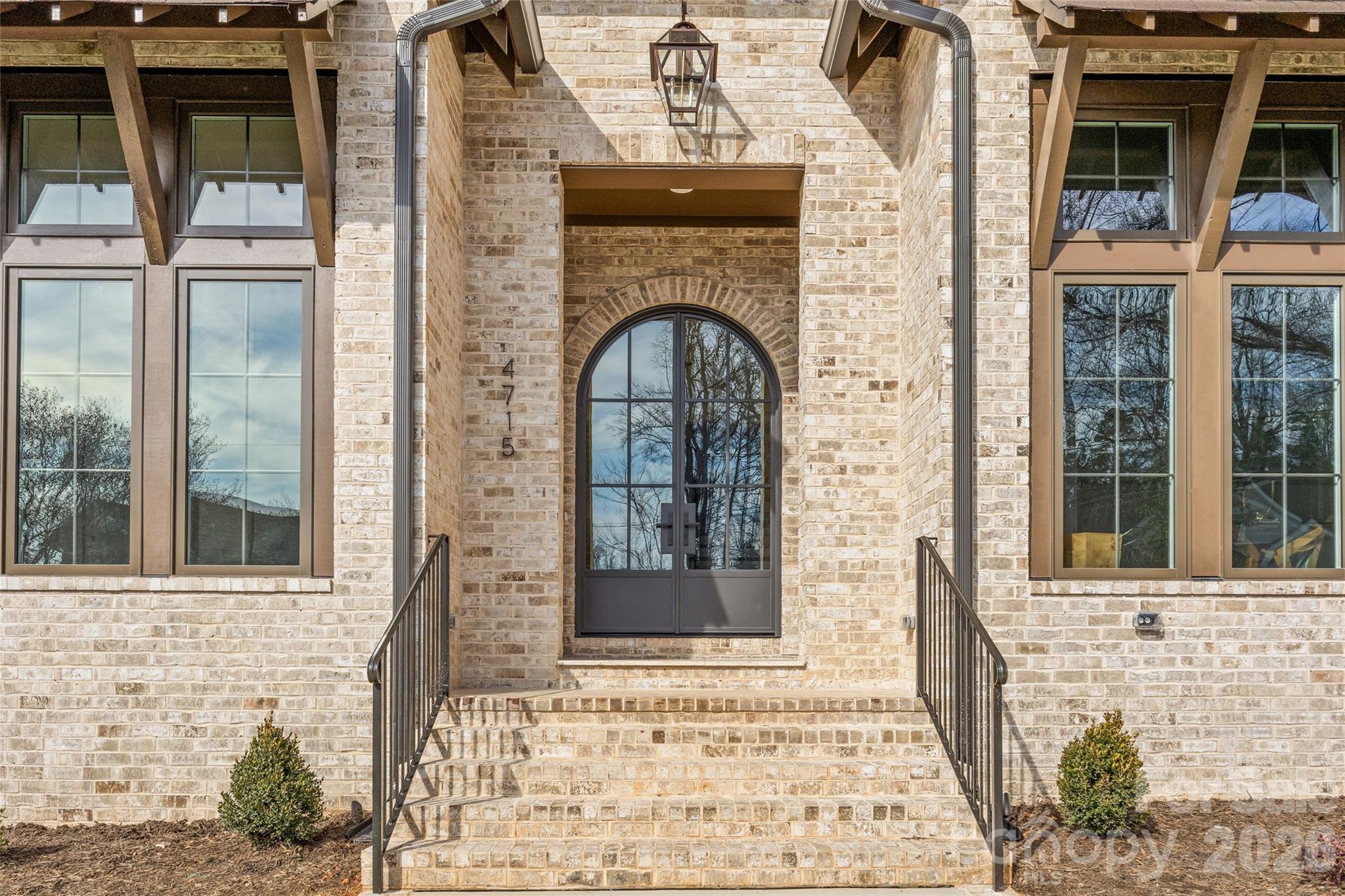 This exceptional custom home offers over 5,200 square feet of beautifully designed living space with five bedrooms and five and a half bathrooms, thoughtfully crafted for both everyday comfort and elevated entertaining.

The primary suite is conveniently located on the main level, creating a private retreat complete with separate his and her walk-in closets. The spa-inspired primary bath features custom cabinetry and a dedicated makeup vanity area, blending function with refined design. Even better, the laundry room connects directly to one of the primary closet for seamless daily living.

At the heart of the home is a stunning custom kitchen designed to impress. It includes a scullery for additional prep space, a walk-in pantry, a built-in coffee bar, and a cozy office nook for managing daily tasks while staying connected to the main living area. For those needing more privacy, a designated office provides a quiet and professional workspace.

The dining room makes a bold statement with it's custom paneling, designer light fixture, and grasscloth ceiling, adding texture and warmth. Just off the kitchen, a bright sunroom or breakfast nook offers the perfect spot for casual meals and morning coffee.

Upstairs, a spacious bonus room provides endless flexibility for a media room, playroom, or lounge. Multiple flex spaces throughout the home allow for a homework nook, craft room, reading space, or whatever your lifestyle requires. A dedicated workout room makes prioritizing health and wellness effortless.

Each secondary bedroom is generously sized, with beautifully appointed bathrooms throughout. And don't miss the main floor powder room with it's showstopping custom viola calacatta marble vanity paired with stunning mural wallpaper, creating a true designer moment!

Practical spaces include a functional mudroom and an attached two-car garage for convenience and storage.

Outdoor living is just as impressive. A covered patio features a full kitchenette and fireplace, making it ideal for entertaining year-round. The large, fenced-in backyard provides ample room for play, or pets.

With thoughtful details, luxury finishes, and versatile spaces throughout, this home offers the perfect blend of elegance, comfort, and functionality — designed to grow with you for years to come!

Come take a look, and make this gem of a home yours!