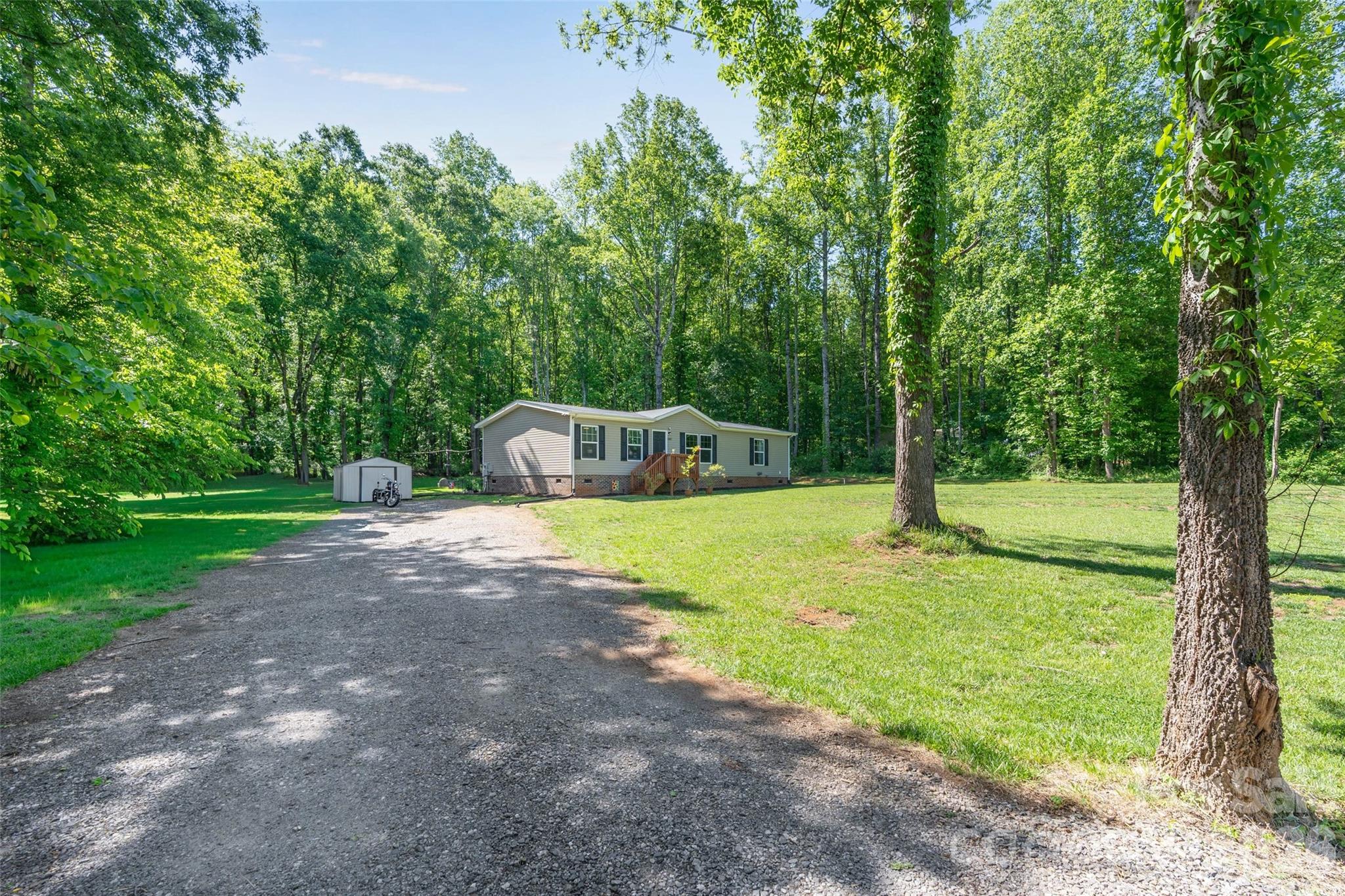 Welcome home to this wonderfully well-kept 2021 home that still feels like new just minutes from downtown Catawba. Tucked away in a private setting on a large lot, you are sure to get that "away from it all feeling". The interior boasts modern white and grey finishes; large rooms and each bedroom is equipped with a walk-in closet. The open floor plan allows for easy entertaining with the living room blending seamlessly into the kitchen and dining area. The house lives and feels cozy. Right off from the kitchen exiting outback, is a laundry room for dropping muddy shoes, or umbrellas on a rainy day. You will fall in love with the back screened in porch, showing off all of its capabilities to be a versatile space no matter if you're thinking of movie night, game night, or grilling space. It has been carefully crafted to encompass the serene views of the backyard but still offer cover from the sun, and the mosquitoes. It is sure to be one of the most used spaces of the house. Close to I-40 for easy commuting to Statesville or Hickory. Book your tour today.