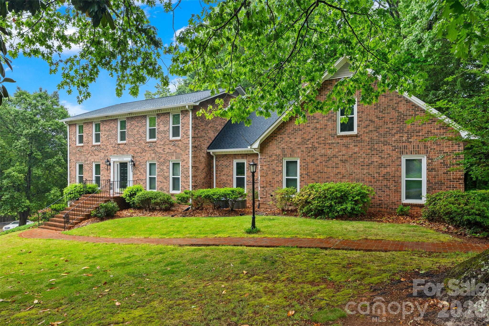 Set on a sprawling 0.84-acre corner lot in a quiet Shiland Hills cul-de-sac, this all-brick estate offers character and modern functionality. The attention to detail is evident before you even step inside, with a classic brick driveway and a side-load garage featuring brick flooring. The heart of the home is the kitchen, where warm brick floors meet granite counters and stainless steel appliances, all overlooking a wooded backyard with a gazebo and a brick patio. The layout is designed for flexibility, offering a bedroom and full bath on the main level, along with a primary suite that includes a private attached office or nursery. Upstairs, a massive bonus room provides additional space for any hobby. The finished basement is a standout feature, serving as secondary living quarters with its own kitchen, recreation room, and a large bar area for entertaining. With a brand-new roof installed in 2024 and close proximity to local shopping and dining, this home is as practical as it is charming.