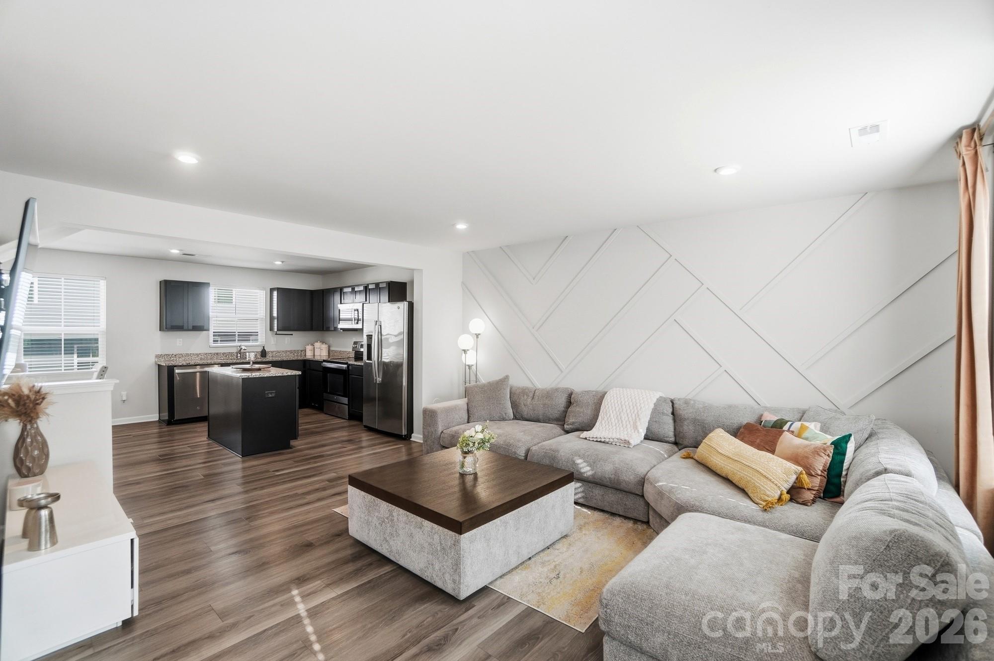 Just Reduced + $10K Lender Credit & No PMI — Your Charlotte Townhome Awaits!
Priced to move at $272K with a $10,000 lender credit at closing and zero PMI, this is the most house your money can buy this close to Uptown Charlotte. Whether you put that credit toward closing costs, a rate buydown, or your move-in budget, the savings are real — and the value is unbeatable.
Step inside this stylish 3-bedroom, 2.5-bath townhome and you'll see why. The open-concept main level is bright, modern, and built for the way you actually live. Upgraded LVP flooring runs throughout the main and lower levels — no carpet, no fuss. The kitchen is the showstopper: granite counters, a generous island made for gathering, and a dining area that flows right into a living room anchored by a custom wood-trim feature wall. It's the kind of space that makes hosting easy and weeknights feel a little more elevated.
Upstairs, all three bedrooms live comfortably together, along with two full baths and a smartly placed laundry room. Yes — the washer, dryer, and every appliance convey. Truly move-in ready.
Downstairs, a finished rec room gives you the flexibility today's buyers want: home gym, private office, media lounge, playroom — you decide. A one-car front-entry garage rounds out the lower level.
Location? Minutes to Uptown, with quick access to major interstates and all the shopping, dining, and entertainment Charlotte has to offer. And because the HOA covers roof, siding, and lawn maintenance, your weekends stay yours.
Stylish. Move-in ready. Brilliantly located. And now $3,000 less — plus $10K from the lender. Homes like this don't sit. Schedule your showing today.