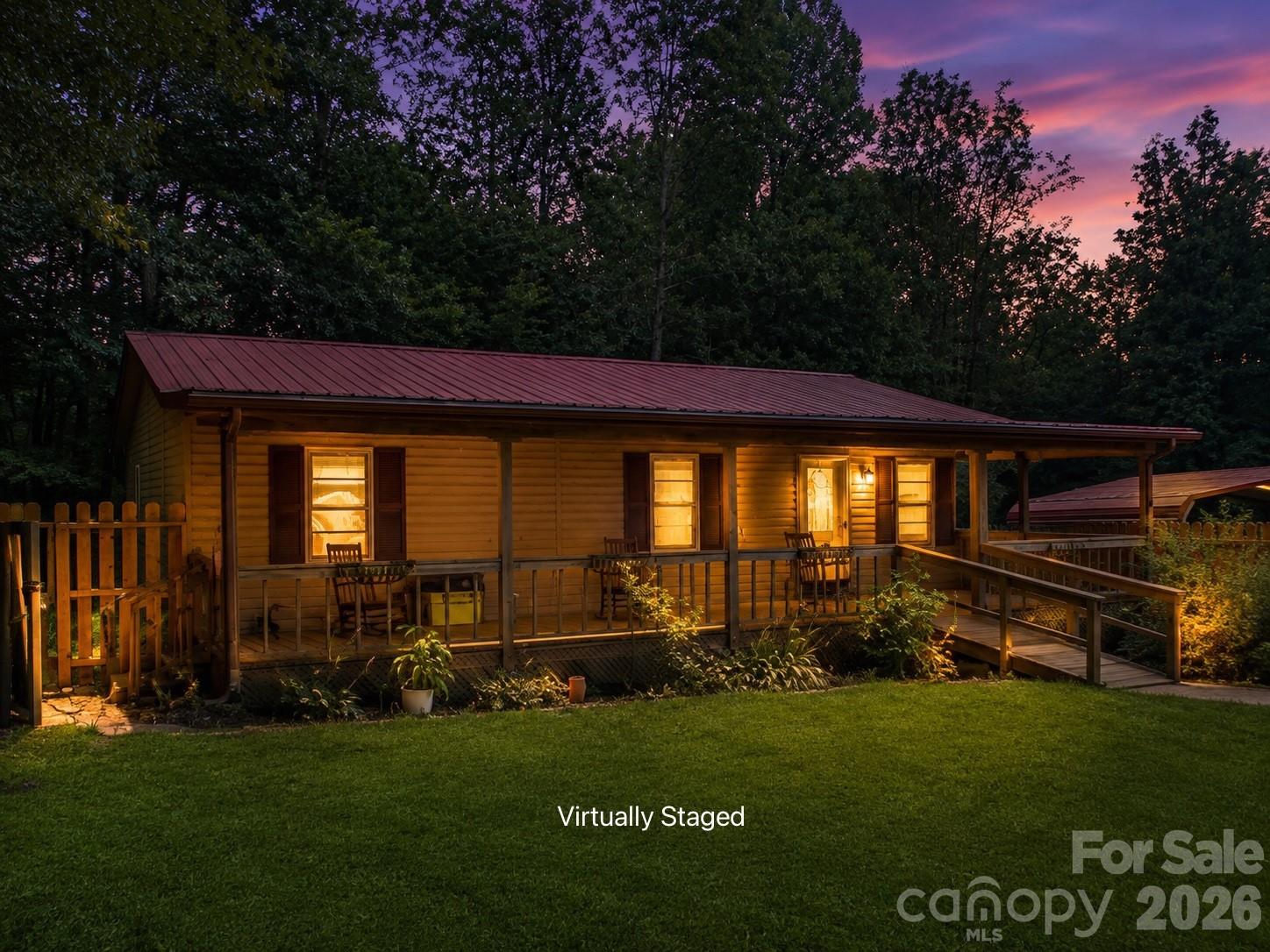 Looking for privacy, peaceful surroundings, and endless possibilities? Welcome to your own secluded retreat at the end of a quiet road! Tucked away on approximately 4.5 beautiful, usable acres, this charming cottage-style home offers the perfect blend of comfort, convenience, and room to grow. Whether you're searching for a full-time residence, a weekend mountain escape, or an investment property, this one checks all the boxes.

The home features 2 bedrooms and 2 full bathrooms, with a 3-bedroom septic system already in place, giving you flexibility for future expansion. Inside, you'll love the spacious open kitchen and dining area, complete with an electric range and newer refrigerator that will convey with the home. The primary suite offers a large walk-in closet and private ensuite bath, while the second bedroom provides comfortable space for family or guests. The bright living room features vaulted ceilings, creating an open and inviting atmosphere.

Step outside and enjoy everything this exceptional property has to offer. The recently fenced front yard is perfect for pets or children, while the expansive level acreage provides plenty of room for gardening, recreation, or simply enjoying nature. Established paths wind throughout the wooded portion of the property, making it easy to explore your own private acreage. A dedicated garden area is already in place, and there is even an RV hookup with both water and electric for visiting guests or your own camper.

Outdoor living is easy with a large covered wraparound porch, double carport, storage shed, and plenty of space for entertaining or relaxing in complete privacy. Despite the peaceful setting, you're just minutes from Lake James, Interstate 40, shopping, dining, and outdoor recreation.

The sellers are also willing to install permanent underpinning and complete the necessary improvements to meet FHA financing requirements with an acceptable offer, opening the door to additional financing options for qualified buyers.

This home is a 1999 singlewide with a thoughtfully designed addition and offers the rare combination of privacy, usable acreage, modern conveniences, and future potential. Properties like this don't come along often—schedule your private showing today.