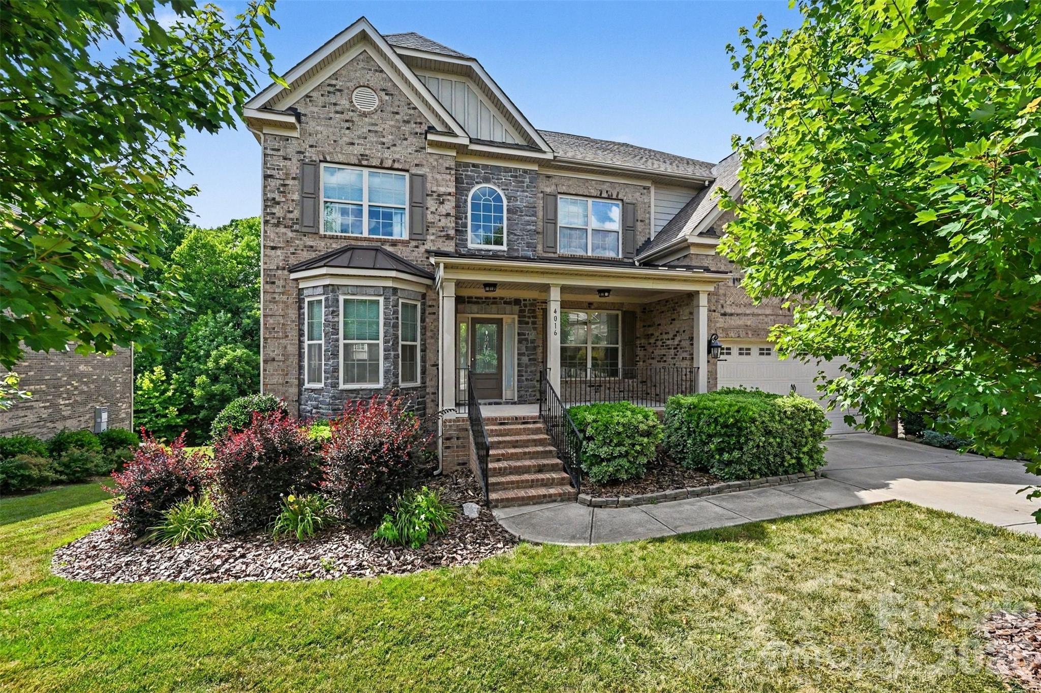 Thoughtfully designed for today’s lifestyle, this distinguished 7-bedroom, 5-bath executive residence with walkout basement offers generous living spaces, refined architectural details, and exceptional versatility. Located in a sought-after Union County community with a clubhouse, pool, and highly rated public schools, this exceptionally maintained home delivers the space, comfort, and flexibility today’s discerning buyers seek.

An inviting two-story foyer welcomes you with abundant natural light and is flanked by formal living and dining rooms that also provide flexibility for a private office, library, or sitting room. Designed for both entertaining and everyday living, the open-concept main level connects the gourmet kitchen, breakfast area, and great room. The kitchen features extensive cabinetry, a large breakfast bar, gas range connection, pantry-style wall of cabinetry, and abundant workspace. Refined architectural details including arched openings, portrait moldings, impressive coffered ceilings, and a dramatic floor-to-ceiling stone fireplace create warmth, character, and timeless appeal.

A main-level bedroom with no built-in closet and full bath provide valuable flexibility for guests or a private office. The spacious laundry room offers abundant cabinetry, utility sink, and workspace. Just inside the finished garage with epoxy flooring and EV charger, a built-in drop zone adds everyday convenience.

Upstairs, generously sized secondary bedrooms feature tray or vaulted ceilings. The spacious primary suite serves as a true owner’s retreat with a decorative tray ceiling and spa-inspired bath featuring a garden tub, oversized walk-in shower, linen closet, private water closet, and walk-in closet. One bedroom features a private en-suite bath, while two additional bedrooms share convenient access to a full bath. A substantial bonus room offers flexible space for recreation, media, fitness, hobbies, or additional living.

The walkout basement expands the home’s functionality with a large recreation room, entertaining/bar area with cabinetry, prep sink, and beverage refrigerator, plus two bedrooms, full bath with tiled walk-in shower, storage room, utility room, and abundant closet space.

Outdoor living includes a spacious deck and covered patio overlooking a fenced backyard and mature trees. Seven bedrooms and multiple living areas provide flexibility for guests, work, recreation, and everyday living. Seller is willing to assist with closing costs.