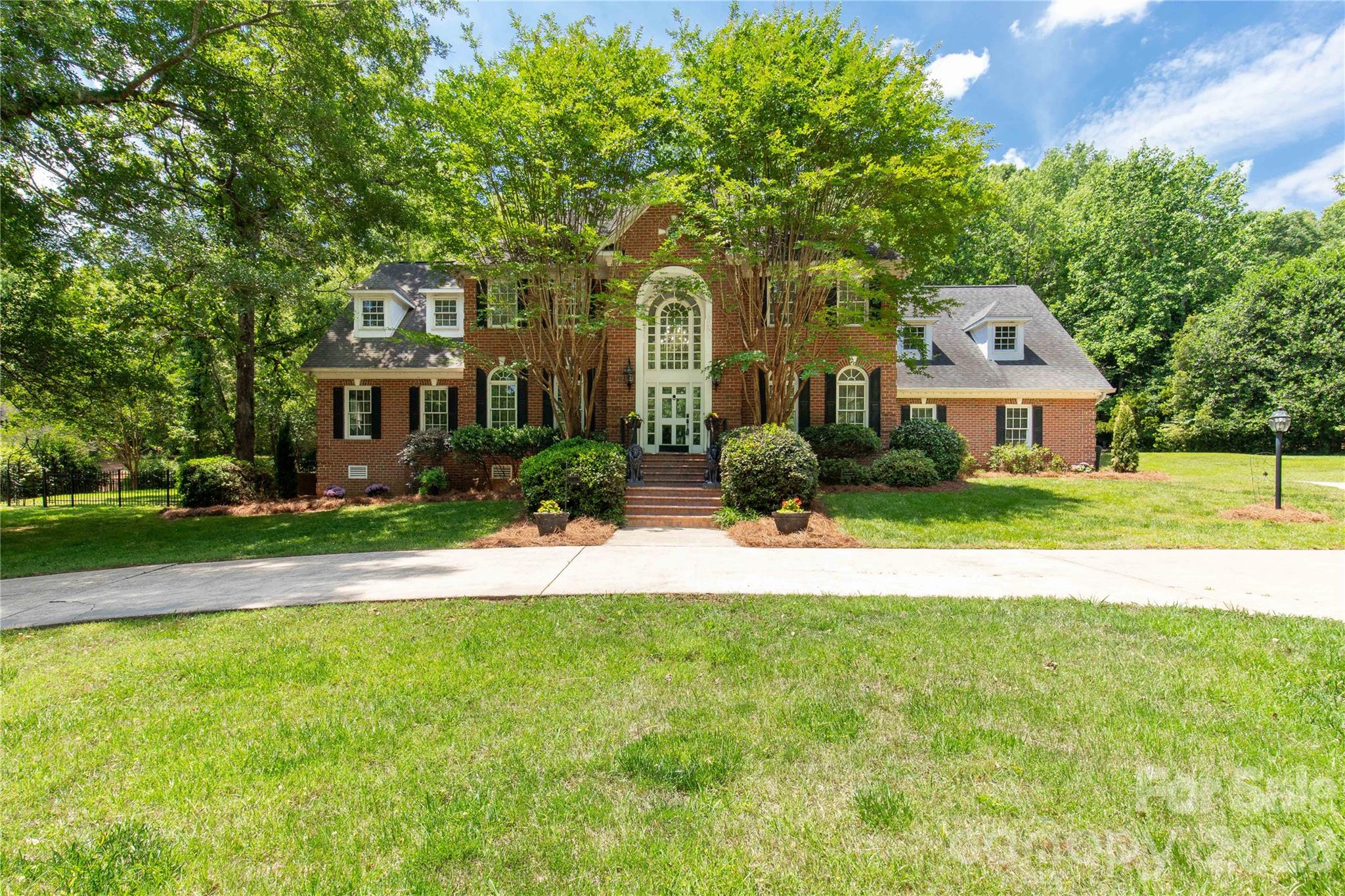 Elegant estate living in sought-after Hickory Estates! This expansive home offers over 5,000 square feet of beautifully designed space with room for entertaining, relaxing, and everyday living. Featuring a desirable primary suite on the main level, the home also includes two staircases, generous storage throughout, and spacious living areas designed for comfort and functionality. Enjoy movie nights in the private theater room or step outside to your own backyard retreat complete with a pool, outdoor kitchen, and over an acre of property offering privacy and space to enjoy. A rare opportunity to own a luxury home with exceptional features both inside and out.