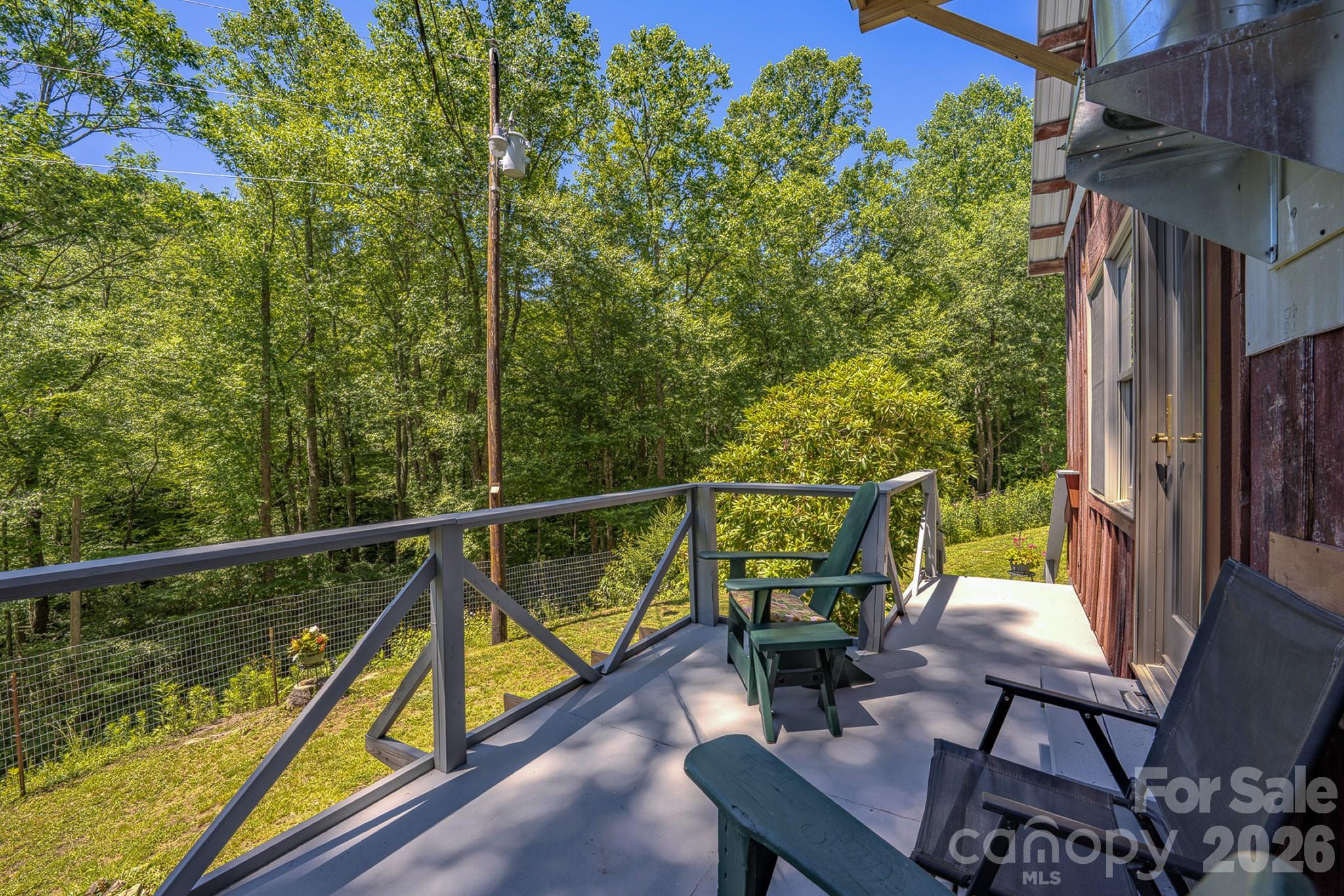 Own a piece of history with the Historic Spring Creek Community Chapel in Hot Springs, now partially transformed into a one-of-a-kind home. This unique property is filled with character, featuring stunning and rare wormy chestnut and cherry woodwork that is truly one-of-a-kind.

Inside, you'll find two cozy sleeping areas and a full bathroom. The layout is unconventional, but every inch of the space is usable. Make sure to check out the kitchen's custom storage features! Head downstairs to discover a full, unfinished sunny basement workshop with exterior entrance, perfect for your next project.

Located on a publicly maintained road, you'll enjoy easy access and winter views of a nearby waterfall. The property also includes the original site-built rectory, a treasure trove of period building materials ready for salvage.

This property is priced for a buyer with vision. The original wormy chestnut floors, currently protected under linoleum, are waiting to be sanded and refinished to their former glory. Please note, the deck does not meet current codes.

This is a rare opportunity for someone ready to bring their creative vision to life. Schedule your visit today and see this incredible property for yourself