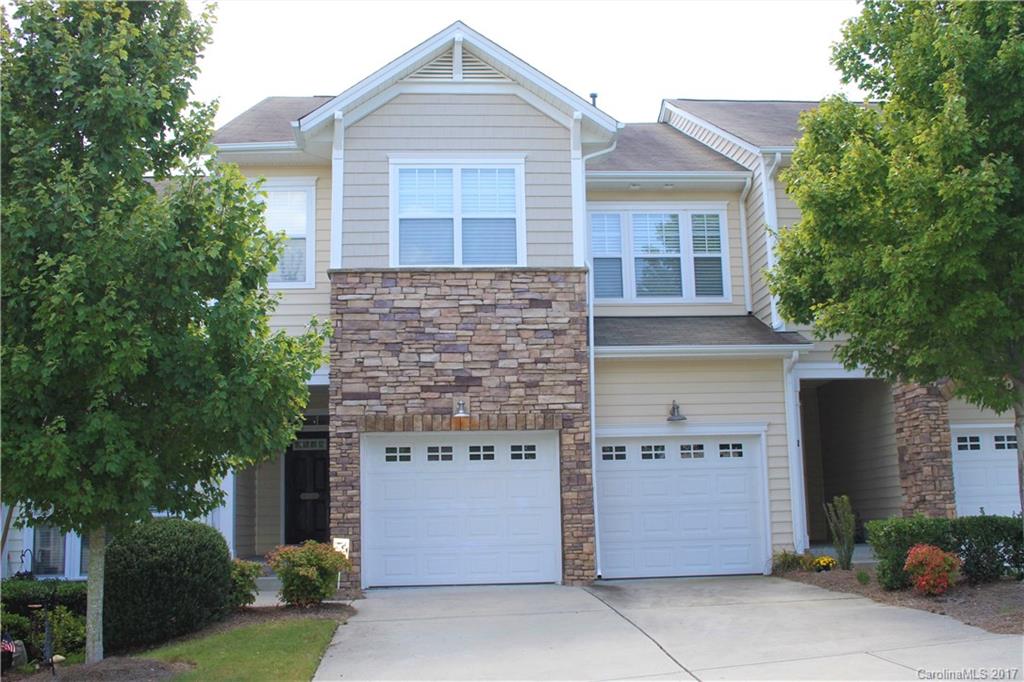 Rare two car garage & dble drive, 4 BR 3.5 BT w/quiet backyard green space on Tega Cay amenity filled peninsula!Granite counters,work island,large pantry, gourmet kitchen w/spacious dining area &breakfast bar. Balcony off kitchen. Large loft area upstairs splits the BRs. Large MBR w/private balcony, walk-in closet, lux bath w/separate garden tub & shower. Walk-out high ceiling finished basement w/rec room, another BR, full bath, and two storage areas/shop areas. Join Tega Cay's great amenities!
