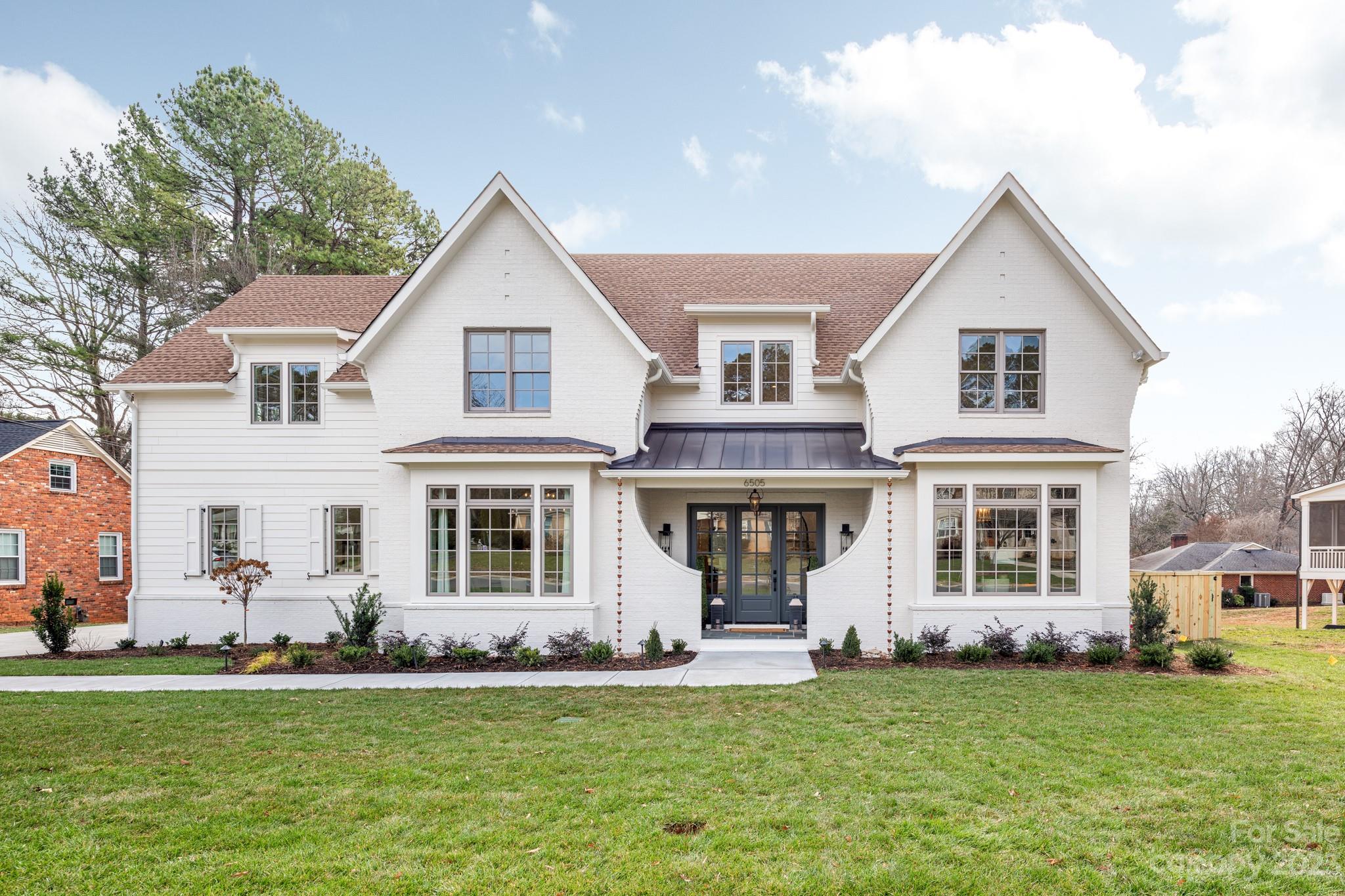 Welcome to this stunning luxury home built by THR Design Build, located in highly sought-after Lansdowne, on .42 acres. Custom plan and finishes include 5 BR, a study, a bonus, and 4,980 sf. Main level features a side load large two car garage, large entryway, open floor plan with formal dining, working pantry, butler pantry, breakfast nook, office, mudroom, and expansive primary suite. Walk onto the screened in covered back porch with outdoor gas fireplace. Designer fixtures feature Visual Comfort lighting, Harkey tile, and Kohler plumbing. White oak hardwoods throughout most of the home, and Isokern gas fireplace with custom plaster surround by Mudwerks and built-in bookcases. Top of the line gourmet kitchen includes, appl. package from Wolf and Sub Zero- 48” Wolf gas range, custom hood, 48” Sub Zero built-in fridge, built in Cove dishwasher. 2 Trane high efficiency heat pumps, spray foam insulation in roof deck.