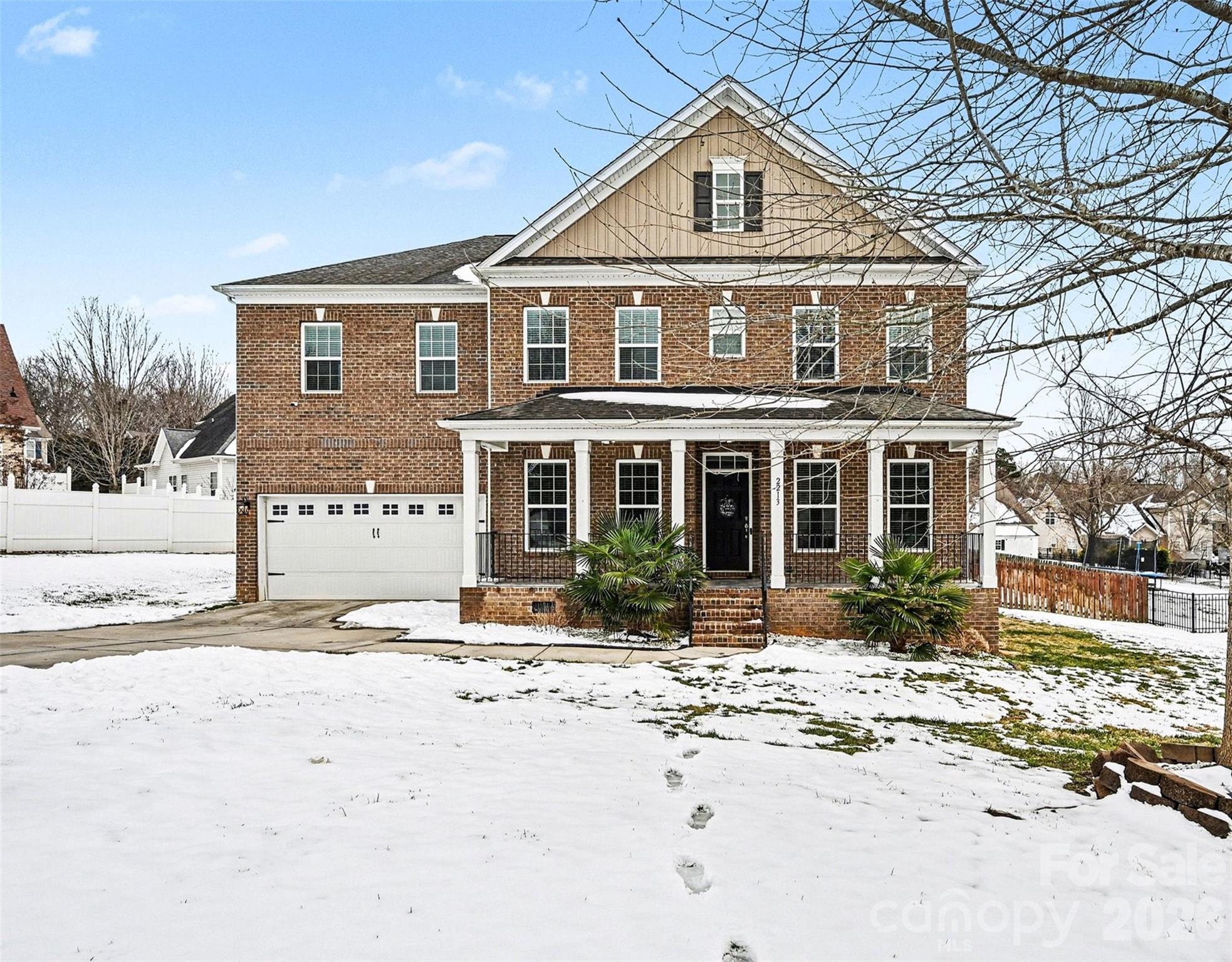 Nestled in the desirable Mill Creek Falls community, this stunning two-story brick residence offers a perfect blend of modern elegance and functional living. The main level is thoughtfully designed to accommodate both work and guests, featuring a dedicated private office and a versatile bedroom paired with a full bathroom, providing an ideal setup for multi-generational living or a quiet workspace.

The heart of the home is a chef’s dream, showcasing meticulous custom work including sleek, dark cabinetry that perfectly complements the high-end quartz countertops. These stunning surfaces provide a sophisticated, seamless look as they transition directly into a matching quartz backsplash. The open floorplan flows effortlessly into the living areas, which are grounded by beautiful prefinished wood flooring and bathed in natural light.

Upstairs, you will find four additional spacious bedrooms, including a primary suite that serves as a true retreat. Every bathroom in the home has been elevated with custom tilework, from the floors to the shower surrounds, reflecting a commitment to quality and style. The upper level also conveniently houses a dedicated laundry room to simplify daily chores.

Outside, the level lot features a fully fenced backyard, a rear deck for entertaining, and a charming front porch. Residents of this community enjoy an array of premium amenities, including a clubhouse, outdoor pool, playground, and game courts. Located in a serene setting while still being close to local conveniences, this 2015-built home is ready to welcome its next owners.