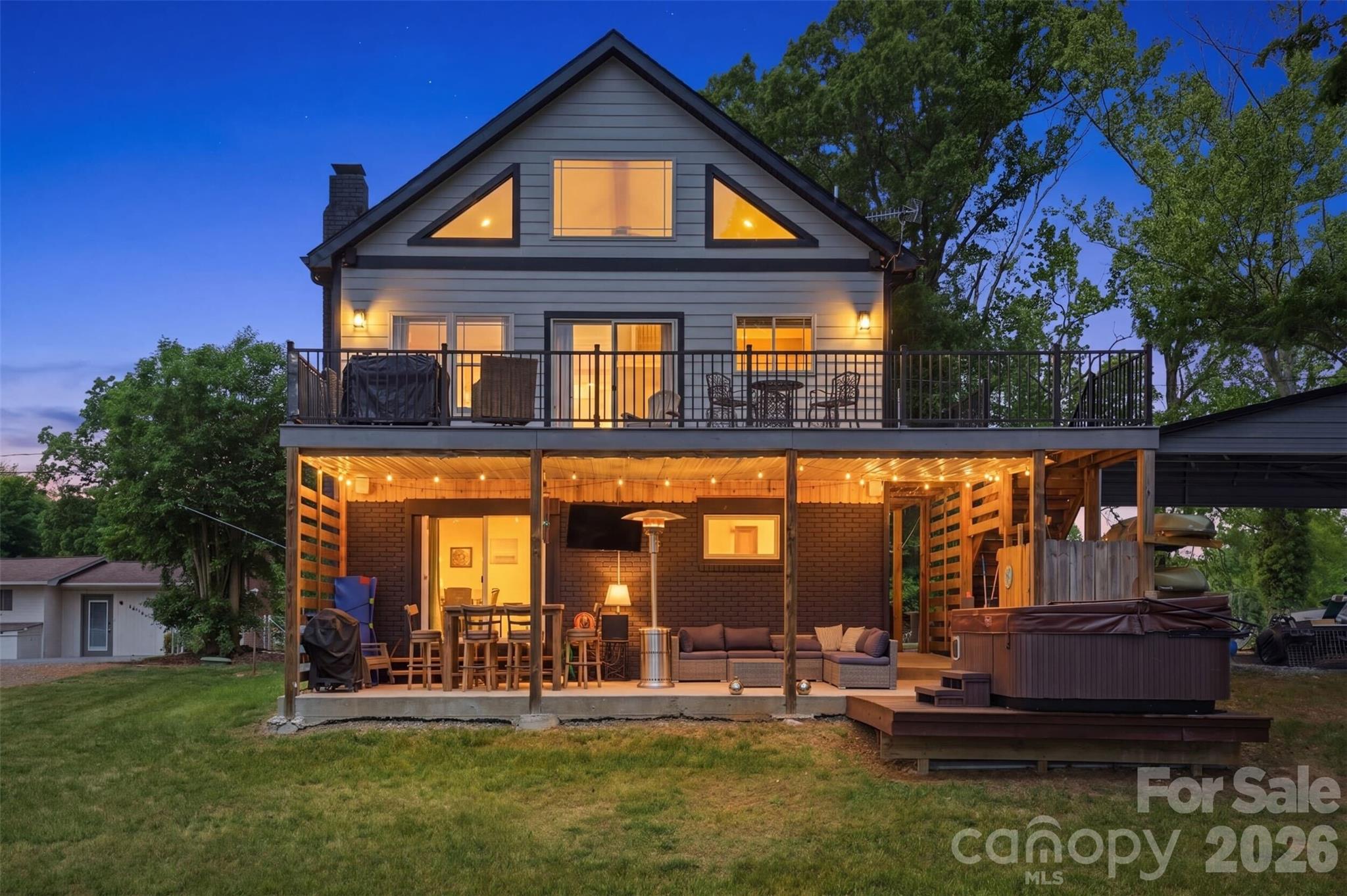 Fully renovated in 2022, this 2 bed, 2 bath lake cabin offers the perfect blend of modern updates and classic charm. The open layout features a cozy fireplace, a loft, and a basement recreation space — plenty of room for everyone. Step outside to your private boat dock, paddle boat launch, and an outdoor shower — because lake days were meant to be lived fully. Located minutes from Hickory and Statesville with easy access to Rock Barn Golf Course and Spa, dining, and shopping. A rare turnkey lakefront property with strong short-term rental potential. Properties like this don’t come around often.