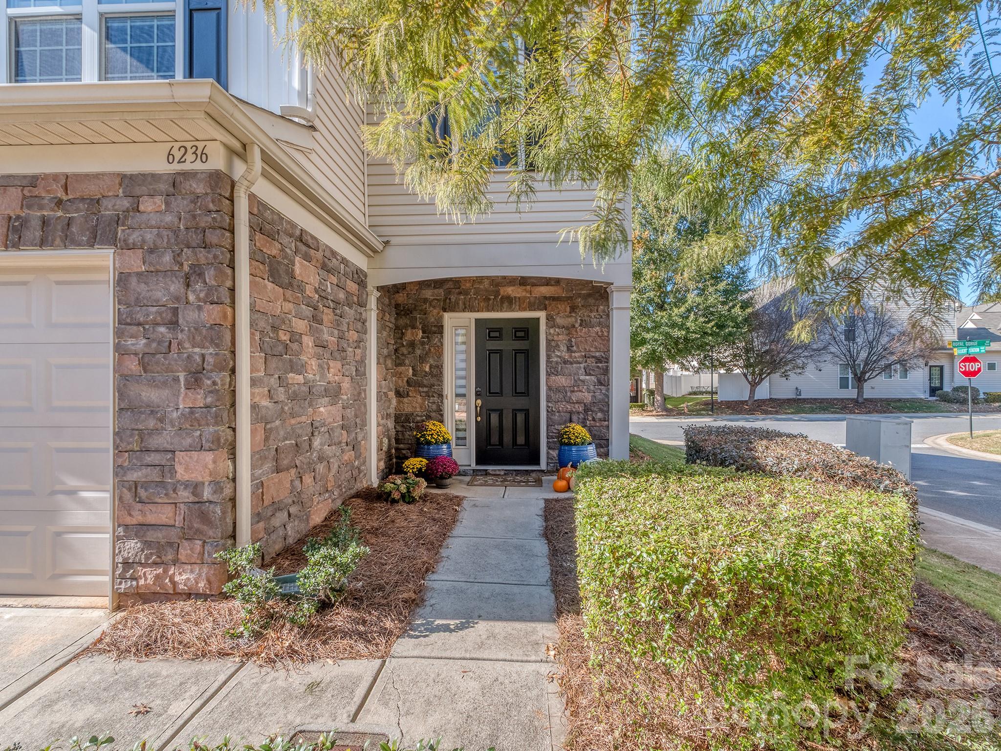 Take your dog to the dog park in the morning and let the HOA handle the yard work! Welcome to low-maintenance living in the gated community of Park South Station. This move-in-ready 3-bed, 2.5-bath end unit townhome sits on a private corner lot just steps from the community dog park, with extra visitor parking right next door. Inside, fresh paint, updated main-level flooring, and updated upstairs carpet set the stage for a light-filled open floor plan where the living, dining, and kitchen flow together for easy everyday living and entertaining. Upstairs, you will find three bedrooms and a spacious primary suite with a walk-in closet and en-suite bath. 

Out back, a private deck makes the perfect spot for morning coffee or evening unwinding, and because the HOA covers the maintenance on the entire exterior of the home and deck, your weekends stay yours. Park South Station delivers resort-style amenities: a Jr. Olympic pool, fitness center, clubhouse, playground, a dog park separated by large and small dogs, a greenspace, regular social events, and a rotating food-truck lineup, plus direct access to the Little Sugar Creek Greenway. Minutes to SouthPark, Uptown, the airport, and major highways. Schedule your tour today!