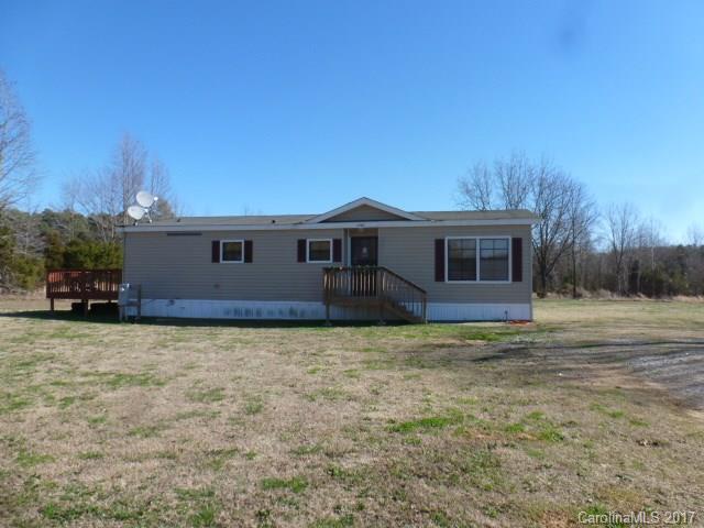 Buford School District. Take a look at his 3BR, 2BA, double wide mobile home, with living room, dining room, nice deck on back and all on 13.65 acres.