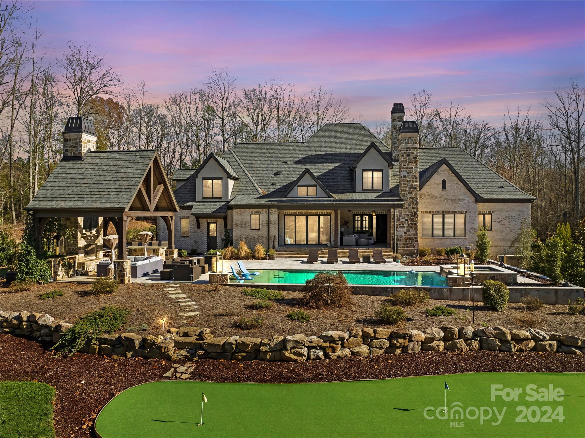 Gorgeous open concept home with outdoor pool, spa and cabana, an entertainer's dream.  This house stuns on every level, from the bar area with exotic granite countertops to the beautiful chef's kitchen with views of the outdoor space, to the stunning wine closest.  Built in 2019 this home shows like new.  The spacious primary suite has access to the screened-in porch, an over-sized walk-in closet and heated floors in the gorgeous bathroom.  A drop zone off the kitchen leads to the 3 car garage with custom cabinets.  A full bathroom has access to the pool and cabana area with fireplace.  All secondary bedrooms are en-suite.  Upstairs flex space can be a gym, craft room, or recreation room.  Large bedroom upstairs with full bath. Walk-in attic spaces provide plenty of storage. 
Golf Membership required.
