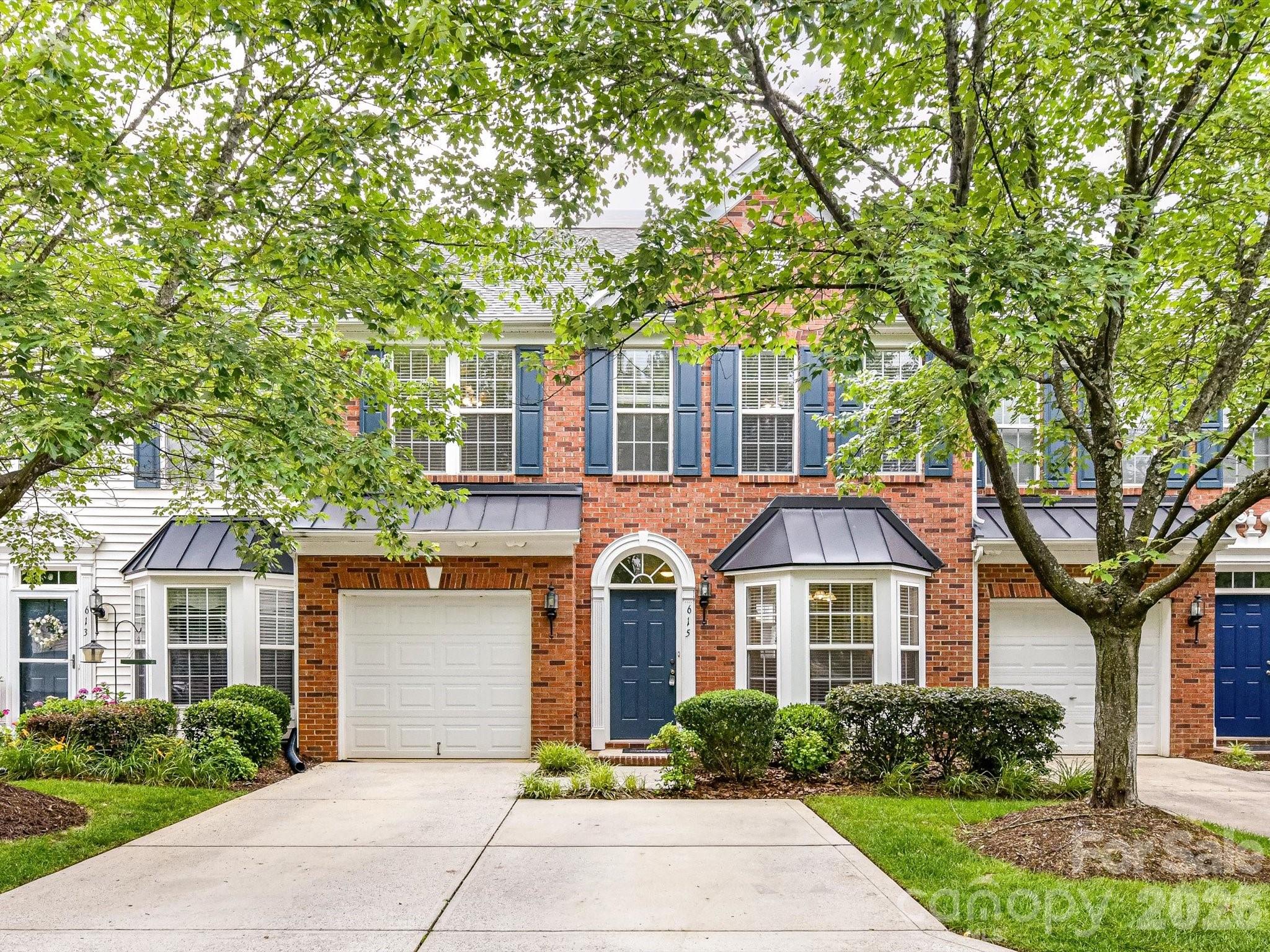 Welcome home to this beautiful brick-front townhome located in the highly sought-after Fort Mill area, known for its Blue Ribbon Award-winning schools! Perfectly positioned across from a charming pocket park, this home offers a rare and highly desirable primary bedroom and updated bath on the main level. Step inside to discover a dramatic two-story great room featuring a cozy fireplace and an abundance of natural light. The spacious floor plan includes large secondary bedrooms, a generous loft area perfect for a home office, media room, or flex space, and plenty of storage throughout. The garage has been enhanced with custom shelving, providing exceptional organization and additional storage space. The updated kitchen features new granite countertops and new appliances, making it both stylish and functional. The primary bath was beautifully renovated in 2019 and includes a large frameless glass shower and updated vanity. Additional improvements include an extra-quiet HVAC system installed in 2019 and brand-new flooring throughout the home in 2026 and new paint in the living and kitchen areas. Enjoy a low-maintenance lifestyle in a prime location just minutes from shopping, dining, and interstate access. With its desirable floor plan, numerous updates, and unbeatable location, this townhome is truly a rare find!