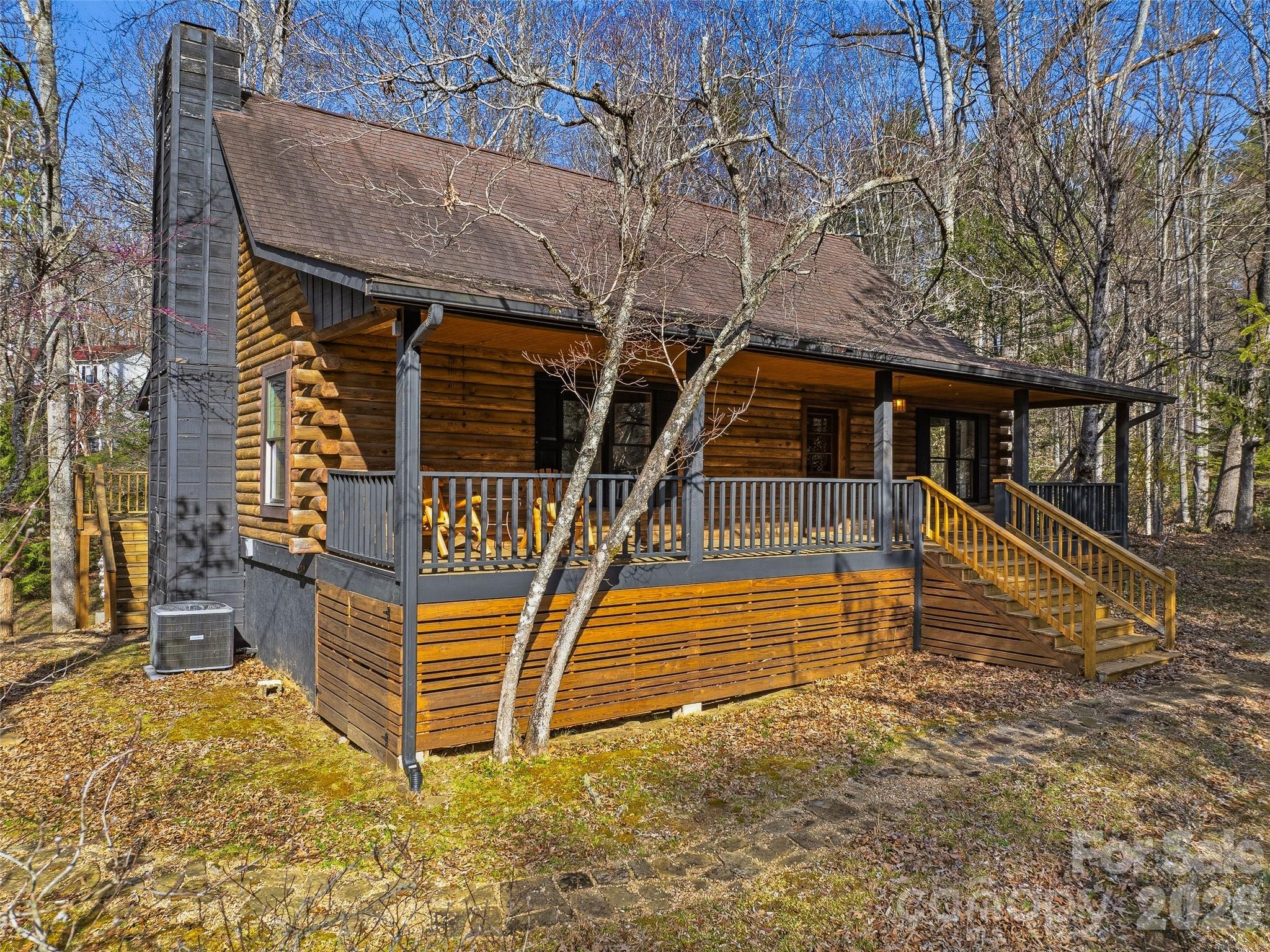If you've been searching for a true mountain log home with room to breathe, this is it. Set across 1.70 acres (three lots!) in the heart of Pisgah Forest, this 2,100+ sq ft, 3-bedroom, 2-bath log home checks the boxes that matter: character, space, and location.
One of the lots borders a peaceful pond, to be enjoyed from the back porch. And with a full unfinished basement, there's plenty of room to grow into this property and make it your own. The home blends classic log home charm with modern updates, so you get the cozy mountain aesthetic without the mountain-sized headaches.
Just minutes from downtown Brevard and under 15 minutes to Pisgah National Forest, you're perfectly positioned for world-class hiking, fishing, biking, and waterfalls while still being close enough to town for great restaurants, breweries, and the community feel that makes Western NC so special.  Great opportunity to make this home your own! Sold as-is, with some deferred maintenance. Previously under contract, but the buyer terminated without sharing reports. Seller is out of the area and unable to make repairs, but is happy to discuss pricing. Buyer to verify all conditions.