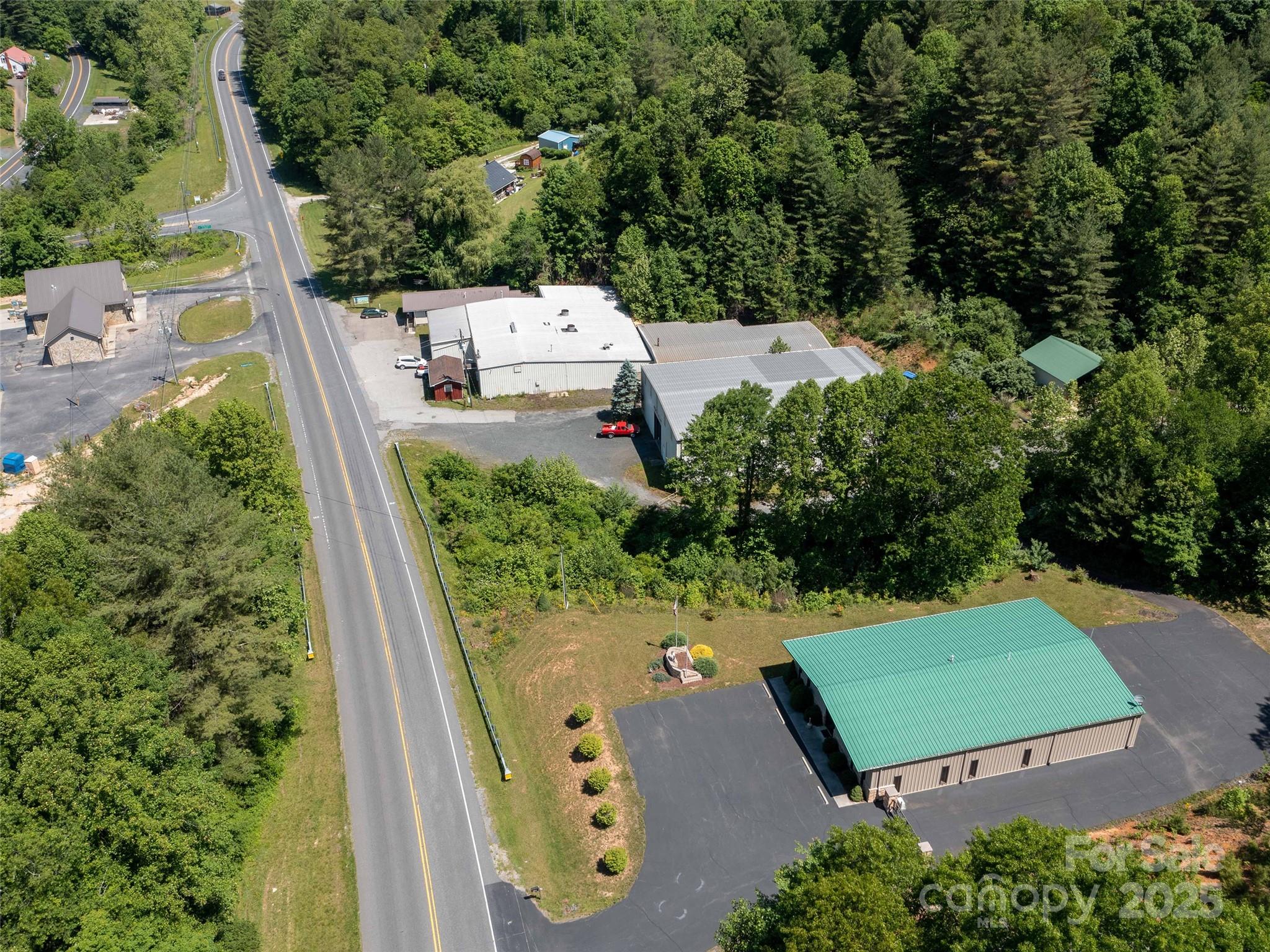 Machine shop with two office buildings. The main structure is a 20,000 sq. ft. facility featuring a large bay with 24’ ceilings and 14’ x 14’ doors on both ends. It is engineered for an overhead crane, with reinforced flooring capable of supporting heavy industrial machinery. The remainder of the building offers insulated ceiling heights ranging from 14–16 feet and includes a built-in 20' x 20' paint room, as well as a small sandblasting room complete with equipment. A shear and a 6’-wide, 20-ton brake are also included. Additionally, there is a small storage room that can serve as a one-room office.
The property includes a 1,250 sq. ft. office area with four rooms, a break room, and two bathrooms. Parking accommodates approximately 20 vehicles, and there are two loading docks suitable for full-size tractor-trailers.
A second, larger office building offers 3,750 sq. ft. with seven offices, a break room, and a conference room.
The owner would consider leasing the large warehouse, currently the larger office building is under lease.
