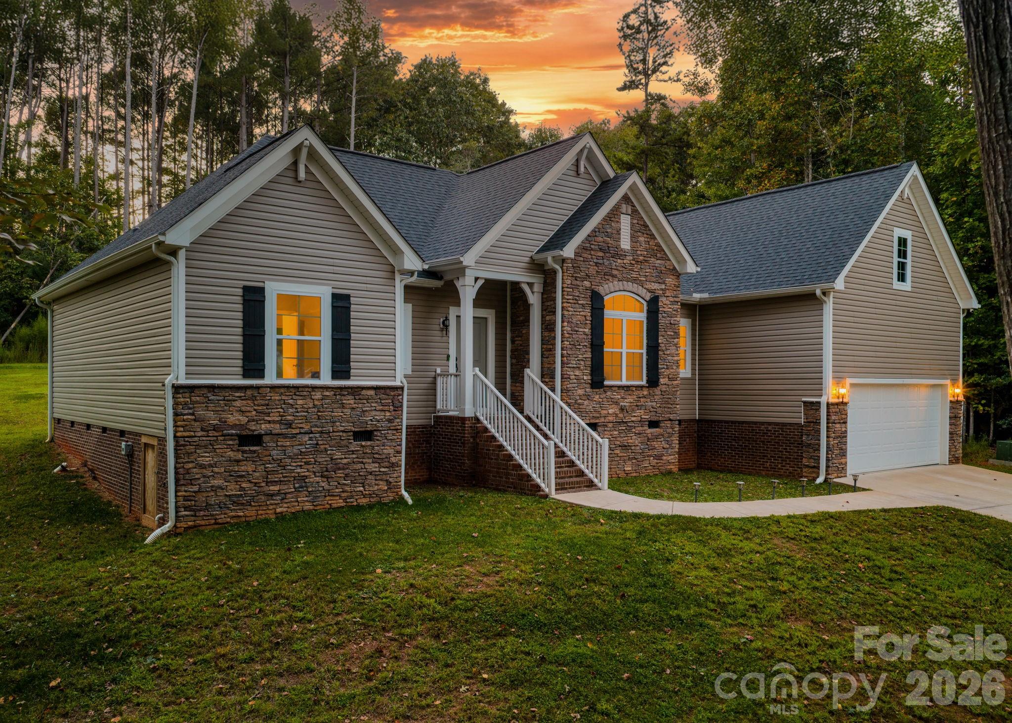 10-year warranty transferable to buyer!  Welcome to this charming single-story 3 bedroom, 2 bath home tucked inside a desirable lake community! As you pull in, you’ll catch a glimpse of the lake, setting the tone for the lifestyle this property offers. Conveniently located less than 5 miles from the Sandbar marina & grill, and downtown Hickory, plus only minutes from the Wittenberg boat access, this home is perfectly positioned for both relaxation and adventure. 
The property features a flat backyard, ideal for hosting gatherings or adding a fence for your furry friends, while the long driveway provides a sense of seclusion and privacy from neighbors. To top it off, enjoy the benefit of no city taxes! As well as large expansive windows in the living area, a beautiful custom tie shower with a large walk-in closet. Highlighting the school district of South Caldwell high school, Granite Falls Middle and Dudley Shoals Elementary!
This is a rare opportunity to enjoy everything hickory has to offer!