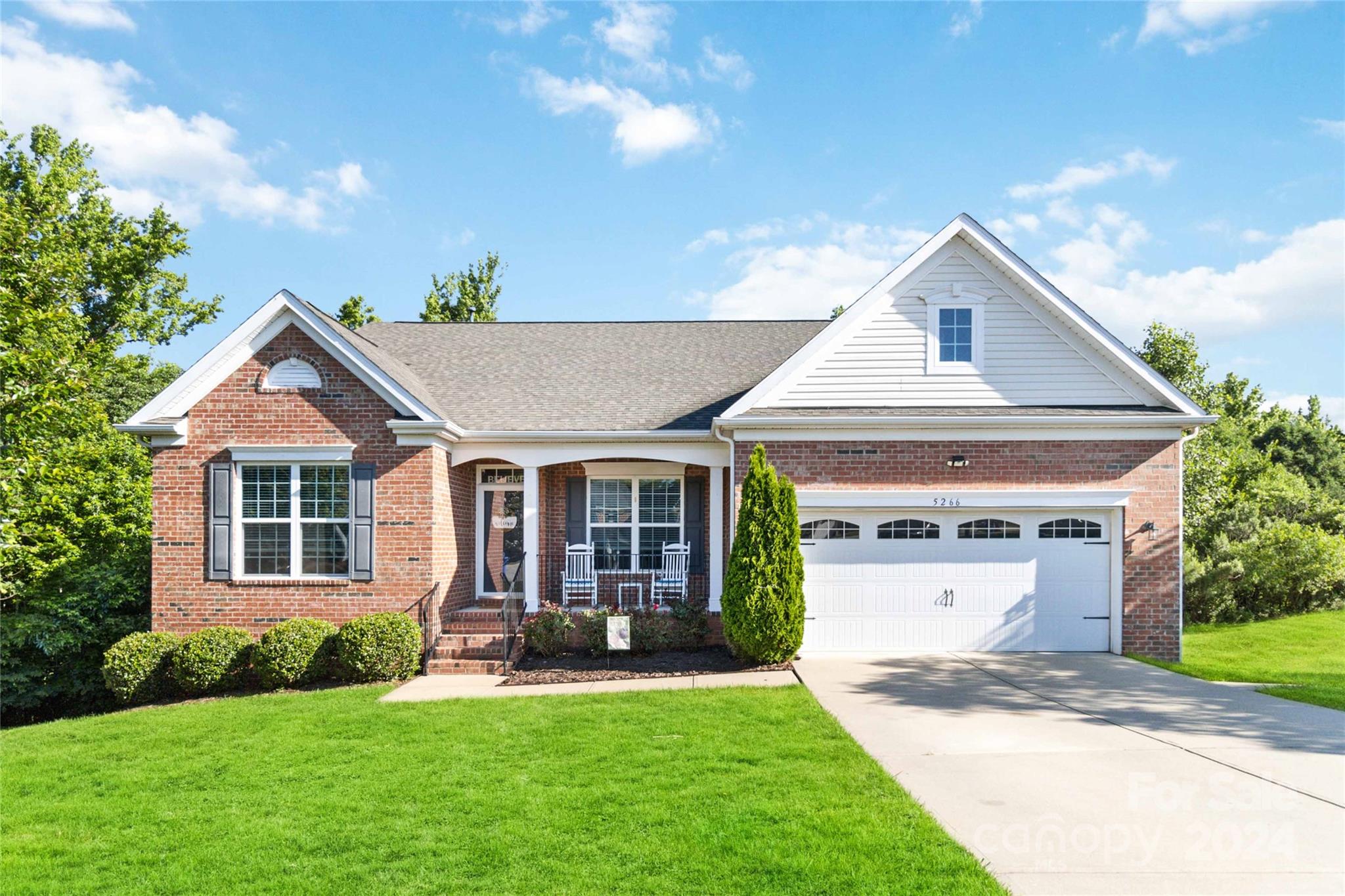 Step into this gorgeous, meticulously maintained, all-brick 1-story home boasting 4 bedrooms and 3 full bathrooms. Gleaming wood floors welcome you into the spacious main living area, adorned with a vaulted ceiling and cozy gas logs fireplace, perfect for relaxing evenings. The open floor plan seamlessly connects the living room to the kitchen, where a stylish island with seating, stainless appliances, and granite countertops awaits. Retreat to the primary bedroom featuring a tray ceiling, dual walk-in closets, and an ensuite bathroom complete with a garden tub, shower, and dual vanity. Downstairs, the partially finished basement offers a large bedroom with a walk-in closet and a full bathroom perfect for an in-law or guest suite with it's own private entrance. The remaining unfinished heated and cooled area presents endless possibilities for a home gym, game room or personalized retreat with a separate storage space. This home is an entertainers dream with the walk out patio.