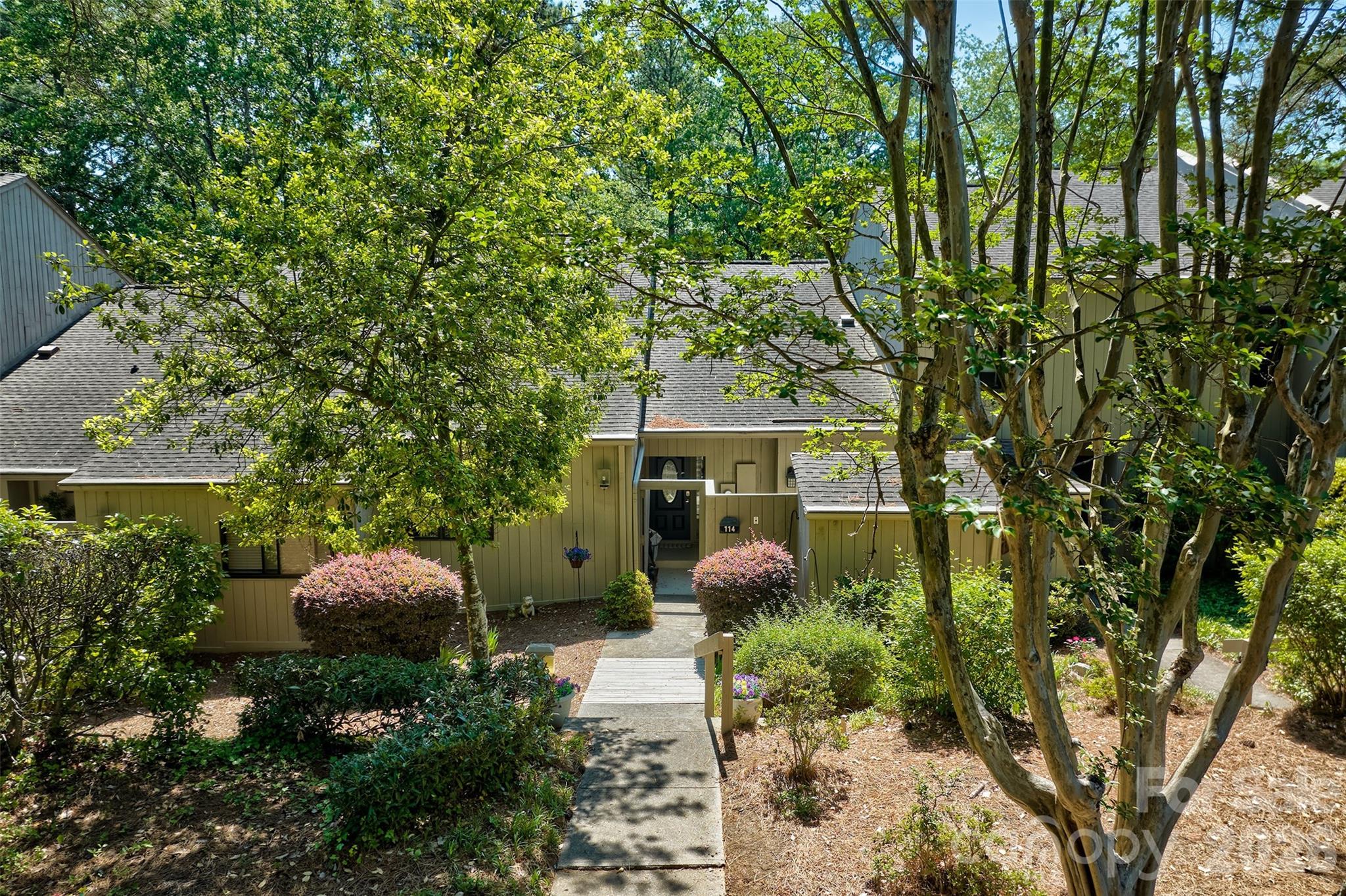 HIGHLY SOUGHT AFTER GARDEN/RANCH STYLE TOWNHOME IN GATED COMMUNITY OF RIVER HILLS ON LAKE WYLIE. THIS SIZE UUNIT DOES NOT COME AVAILABLE OFTEN.   THIS HOME OFFERS 2 BEDROOMS AND 2 BATHS, OPEN FLOORPLAN WITH CATHEDRAL CEILINGS, COZY SUNROOM, 2 OUTDOOR LIVING AREAS TO ENJOY THE TREES WITH A BACK PATIO AND FRONT DECK OFF THE KITCHEN.  THE BLUFF VILLS HAVE THEIR OWN PRIVATE POOL AND CURTESY DOCK.  THE NEIGHBORHOOD OFFERS MILES OF WALKING PATHS, WATERFRONT PARK WITH SANDY BEACH AND PICNIC PAVILION, 24/7 SECURITY FORCE, GARDEN PLOTS, DOG PARK, PLAYGROUNDS , MARINA AND 18 HOLE CHAMPIONSHIP GOLF COURSE AND COUNTRY CLUB.  THE MARINA AND COUNTRY CLUB ARE SEPARATE MEMBERSHIPS.  PLEASE CONTACT AGENT FOR FEES.   EASY COMMUTE TO CHARLOTTE INTERNATIONAL AIRPORT, FORT MILL, ROCK HILL, CHARLOTTE AND BELMONT FOR WORK.  THIS HOME HAS BEEN WELL MAINTAINED AND CARED FOR.  WELCOME TO LIVING AT THE LAKE!