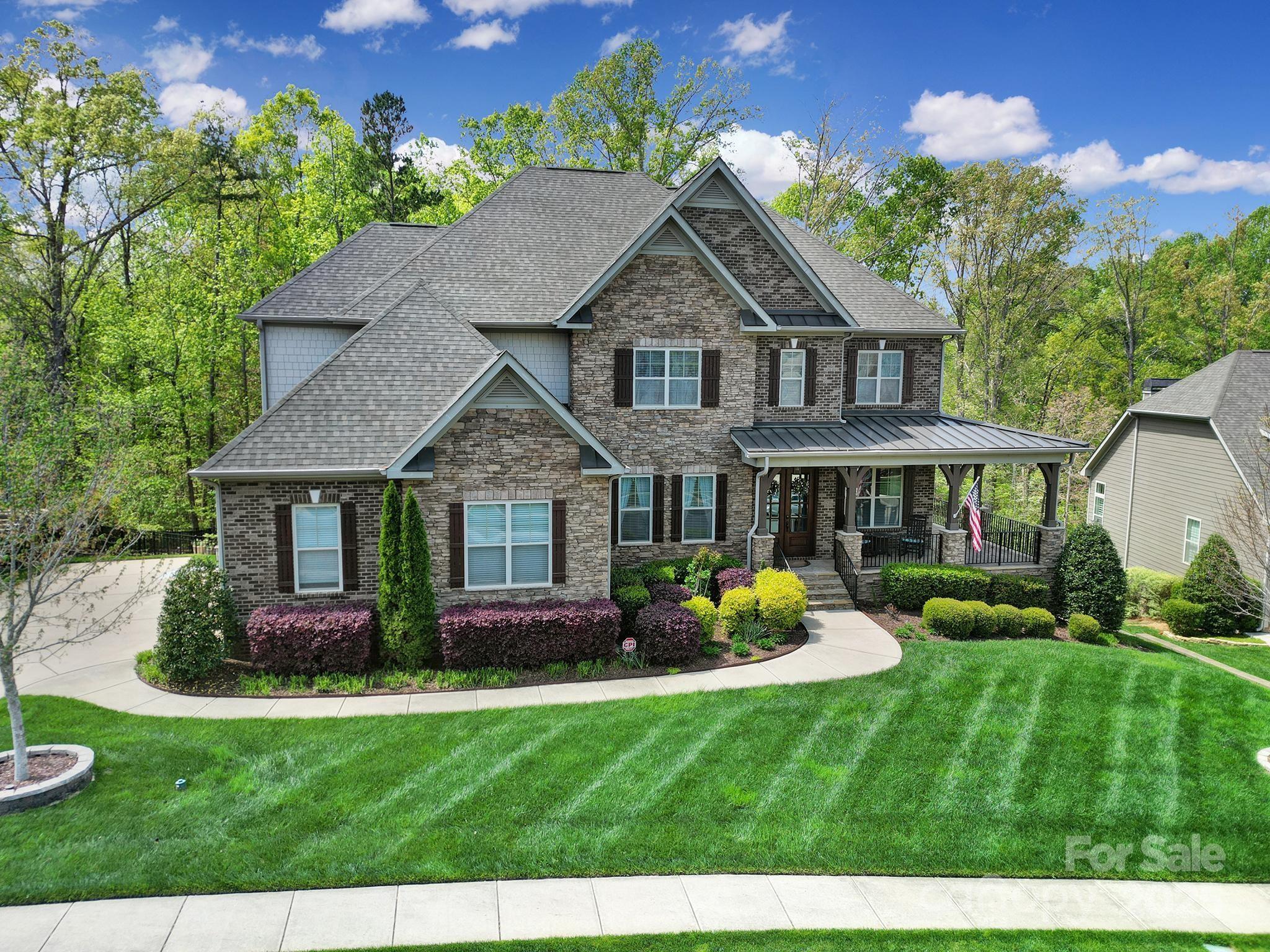 Welcome to a beautifully maintained, move-in-ready estate where luxury and upgrades, comfort and lifestyle come together. This stunning 5-bedroom, 5.5-bath residence offers the perfect blend of sophistication and function, complete with a private, tree-lined backyard oasis featuring a heated in-ground pool. 
Designed with entertaining in mind, the open-concept living area flows seamlessly into a chef’s kitchen featuring a spacious island, ideal for hosting gatherings. The finished basement includes a kitchenette w/ wine fridge, game room, media room, and gym/office. 
A screened-in porch overlooks the pool, creating multiple spaces to relax and unwind. 
Enjoy 2 primary suites—one on the main level and one upstairs—perfect for multi-generational living or accommodating guests in style. And two laundry rooms!
See a full list of all features and upgrades in the attached brochure.
Lakeridge offers access to top-rated Fort Mill schools, Lake Wylie, Tega Cay events, and nearby ballparks.