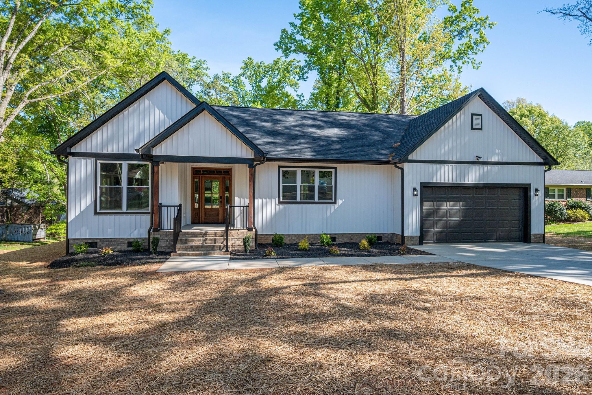 This beautiful new construction home in Cherryville, NC is a must-see! Step inside and immediately feel the comfort and openness of the thoughtfully designed open-concept floor plan, offering seamless flow between the living, dining, and kitchen areas—perfect for everyday living and entertaining. The kitchen is truly the center of the home, featuring elegant quartz countertops, a large gathering island, and stylish finishes that make cooking and hosting a joy. Beautiful flooring runs throughout the home, adding both durability and modern appeal. This spacious 3-bedroom, 2-bath home offers generous living areas and ample closet space. Step outside to the large covered back porch—ideal for morning coffee, relaxing evenings, or hosting friends and family. The two car garage is perfect for keeping your cars protected from the weather. Conveniently located near Cherryville, Shelby, Lincolnton, this home combines comfort with accessibility. Don’t miss the opportunity to add your personal touch—buyers under contract prior to completion may have the option to select paint colors. Completion date should be early April.