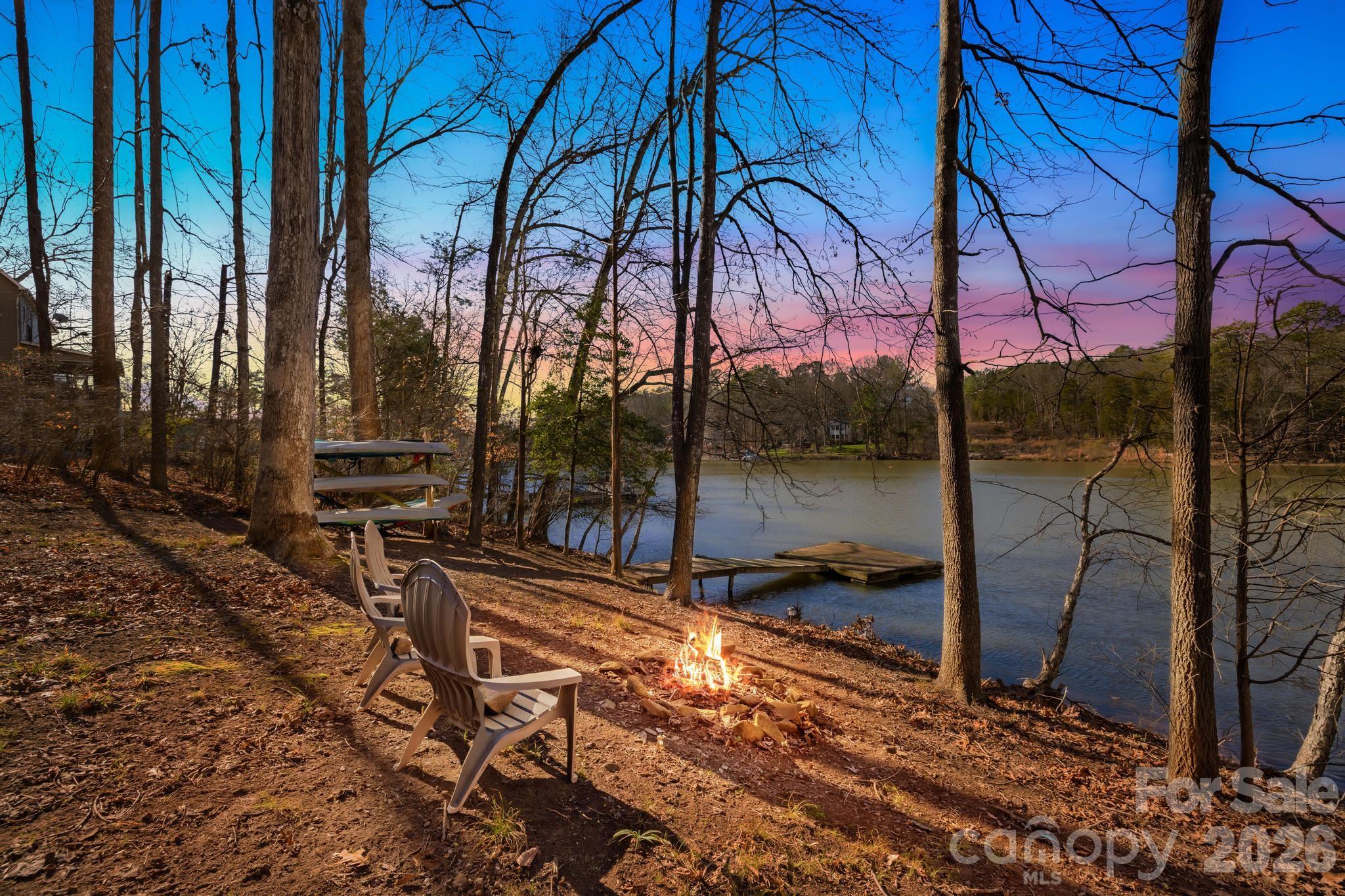 Own the Lake...Own the Income...Own the Privacy! Most waterfront properties force you to choose between a quiet retreat and a convenient location... We are offering you A rare 0.92-acre Lake Wylie estate offers both; combining over 200 feet of private shoreline and private sanctuary! Whether you are looking for a primary sanctuary, a legacy second home, or a high-yield income asset {with full Airbnb flexibility!}, this is the most versatile waterfront opportunity on the market.
The "Private Cove" Advantage: Situated on a serene, deep-water cove (6ft+ depth at full pond), you avoid the noise and rough wake of the main channel while maintaining instant access to Lake Wylie’s top destinations like Papa Doc’s, Starbucks, Planet Fitness and the shops at HWY 49.
Legacy Construction, Modern Luxury:
• The Vibe: Authentic log-cabin warmth met with "designer-level" sophistication—skylights, original hardwoods, and a massive wood-burning fireplace.
• The Chef’s Hub: Fully reimagined with granite counters, slate flooring, and a farmhouse sink.
• The Infrastructure: Peace of mind is built-in with a NEW roof, NEW septic system, and a modernized water filtration system.
Outdoor Resort Living: The expansive lake-view deck and screened porch flow into nearly an acre of curated grounds. With the planned dredging and your private dock, your sunset cruises and paddle sports are guaranteed year-round.
Future Potential: The 800-sq-ft unfinished basement is your blank canvas for a gym, theater, or additional rental suite to maximize your ROI.
This isn't just a home; it's a strategic land hold in a community where privacy is the ultimate luxury. Don't just visit Lake Wylie—own the best version of it.  //   
** PS-Very private cove and community! / **Watch the Walk-Thru VIDEO and see why this is the best value on the Lake!