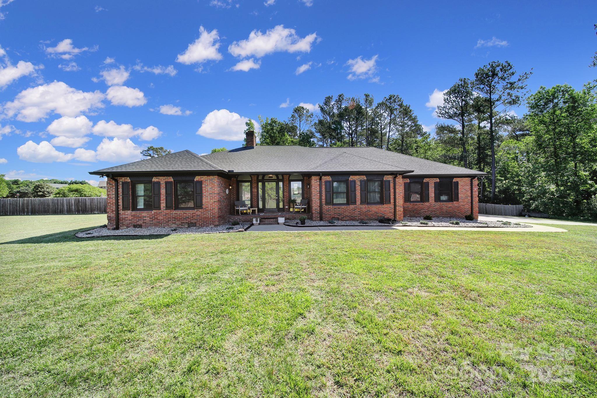 BACK ON MARKET after being on the market for 9 hours! 
Tucked away on approximately 4.18 acres of both open and wooded land, this custom brick ranch offers space, privacy, and thoughtful updates throughout.  Inside, you'll find a warm and welcoming layout with a sunken den, formal dining room, study, and an inviting eat-in kitchen—all updated with refreshed flooring and modern finishes. The split-bedroom floor plan adds a sense of privacy, with the spacious primary suite located just off the kitchen. The remodeled en-suite bath is a true retreat, complete with a spacious tiled shower and separate soaking tub for relaxing at the end of the day. An attached two-car garage and a separate one-car garage/workshop provide plenty of room for vehicles, hobbies, or storage. Don't wait - schedule your private tour today!
