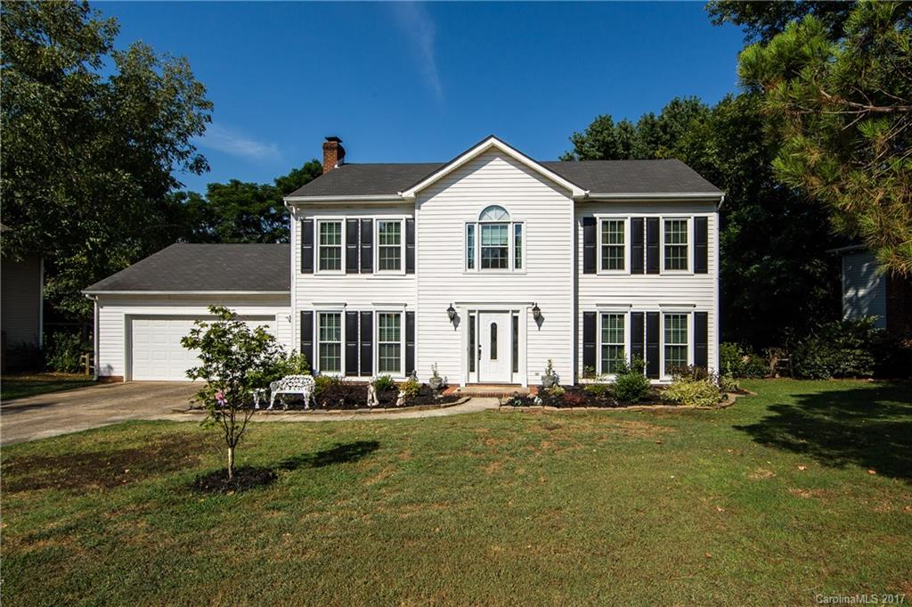 Beautiful 4 bedroom, 2.5 bath home in popular Cedarfield community. Come enjoy this updated kitchen w/granite, ss appliances and ceramic tile. Hardwood floors throughout the 1st floor with wood-burning fireplace in family room.  All new windows installed in 2015.  Relax on your deck in your shaded, fenced-in backyard. A short walk to the pool and playground, walking/biking trail nearby. Close proximity to shops, restaurants, & grocery. An ideal location for easy access to Charlotte.
