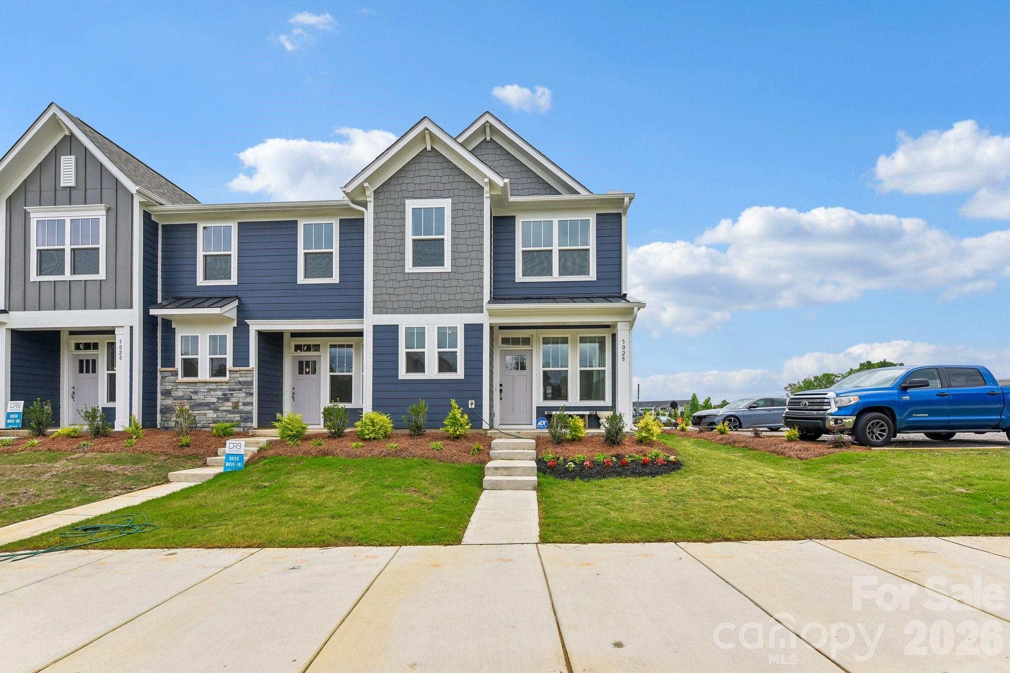 Welcome to Odell Park Premier Townhomes Offering the Most Convenient Access to Regional Commuter Routes and Concord Mills. Our Rochester plan features 3BR / 2.5BA  with a 1-car garage offering modern design and practical spaces just minutes to I-485 , Highland Creek, and Concord Mills Blvd. The main level features an open-concept layout with luxury vinyl plank flooring. The kitchen includes quartz countertops, stainless steel appliances, a spacious island, and an approximately 12' deep finished storage closet—ideal for pantry or utility use. A bright dining area and connected family room make the space inviting for both daily living and entertaining. Upstairs, the Rochester plan offers three bedrooms, two full baths, and a convenient laundry closet. The primary bedroom and bathroom highlight a 5' tiled shower, dual vanities, and a large walk-in closet. Secondary bedrooms provide flexibility for work-from-home, guests, or hobbies. Odell Park offers quick access to  shopping, dining, parks, major highways, UNC Charlotte, and local employment centers. HOA services cover water, trash removal, lawn care, and landscaping, supporting a low-maintenance lifestyle in a convenient Charlotte location. This home is ready for a Quick Move - In.