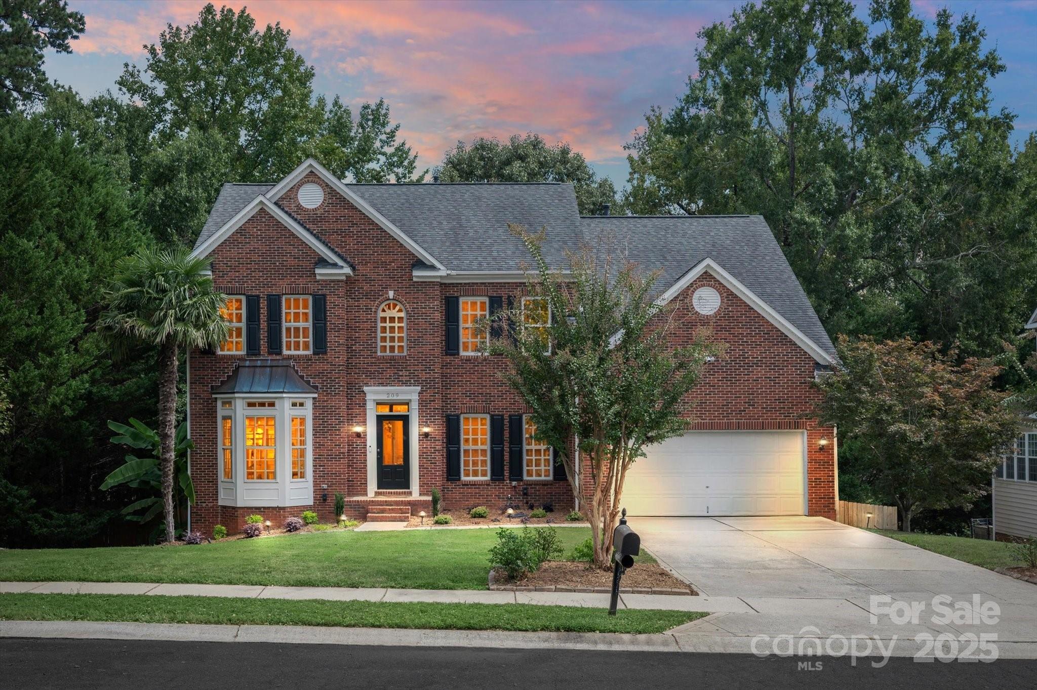 Welcome to the highly sought-after Whitegrove community! This beautiful brick-front home offers three full levels of living space, including a finished walkout basement, and sits on over a third of an acre with a flat, usable yard. With 5 bedrooms and multiple flex spaces, this home provides all the versatility you could dream of- all in a prime Fort Mill location known for its award-winning schools, new conveniences, and established neighborhood charm.
Step inside to newly refinished oak wood floors (2023) and a grand staircase that sets the tone for the home’s spacious design. To one side, a formal living and dining area with elegant wainscoting and a bay window is ideal for entertaining. To the other, a private office with a convenient closet for storage, along with a half bath, provides flexibility for today’s lifestyle. The kitchen features updated stainless steel appliances (refrigerator and dishwasher new in 2023) and is filled with natural light and views of the private backyard. The adjoining breakfast area and open great room, anchored by a cozy gas fireplace, make this the perfect gathering space for everyday living.
Upstairs, you’ll find five spacious bedrooms and two full baths, highlighted by a generous primary suite. Complete with a tray ceiling and large walk-in closet, the suite is complemented by a spa-like bath featuring a garden tub, tiled shower, and dual vanities. The secondary bedrooms, give you  the option for guest rooms, home offices, activity rooms or creative spaces to fit your needs.
The finished walkout basement expands the possibilities even further. With a full bath, 2 flex rooms, and large entertainment space, it can easily serve as a guest suite, gym, media room, or all of the above. Hosting is made fun with the custom bar featuring a built-in kegerator and shiplap accents, while the direct walkout to the yard creates seamless indoor-outdoor living.
Outside, the yard is a private retreat designed for both relaxation and recreation. A large deck overlooks the fenced yard, which offers endless potential - a perfect setting for a pool, hot tub, sports, play area, fire pit, or any combination.
This home has been thoughtfully updated for peace of mind, including:
    •    Back windows replaced (2023)
    •    Carpet replaced (2023)
    •    Wood floors refinished (2023)
    •    Lighting updates (2023)
    •    Interior painted (2023)
    •    New fence (2023)
Additional features include a home security camera and alarm system, both of which will convey. Whitegrove’s friendly community offers walking trails and easy access to all of Fort Mill’s amenities. A brand-new Harris Teeter is under construction nearby, adding to the appeal of this vibrant and growing area.
With its thoughtful updates, multiple flex spaces, flat usable yard, and prime location, 209 Whitegrove is a rare find. Come see why this home is the perfect blend of comfort, versatility, and convenience in Fort Mill.