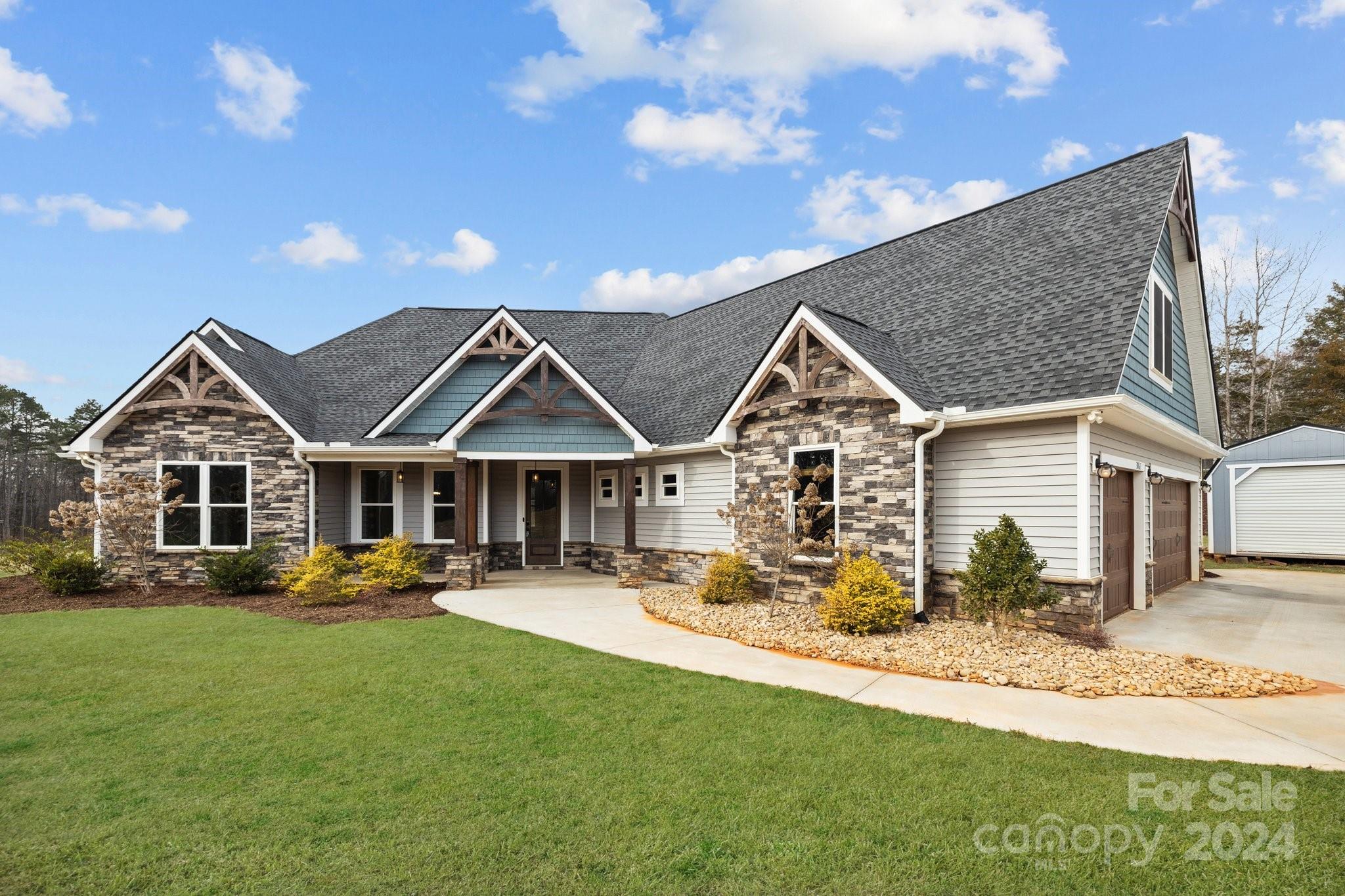 Welcome to your dream home on 7.37 acres, blending luxury with tranquility.This stunning 4-bed, 4.5-bath haven boasts meticulous design and spacious living areas filled with natural light creating an inviting opportunity for gatherings or quiet moments of relaxation.The amazing kitchen features premium appliances, modern fixtures and granite countertops.Retreat to the lavish primary suite with a spa-like bathroom and walk-in closet.Plus, there are three more bedrooms, and one of which has its own en-suite for added convenience. Upstairs you will find a large bonus area and full bathroom.Enjoy a dedicated office space, cozy outdoor fireplace on the screened in porch, luxury vinyl floors, and tall ceilings.The vast acreage allows for endless outdoor recreation,such as horse and atv riding.Additional features include a 3 car garage,an out building, and solar panels.Close to amenities yet secluded, this property offers the epitome of luxury living. No HOA! Schedule your tour today!!!
